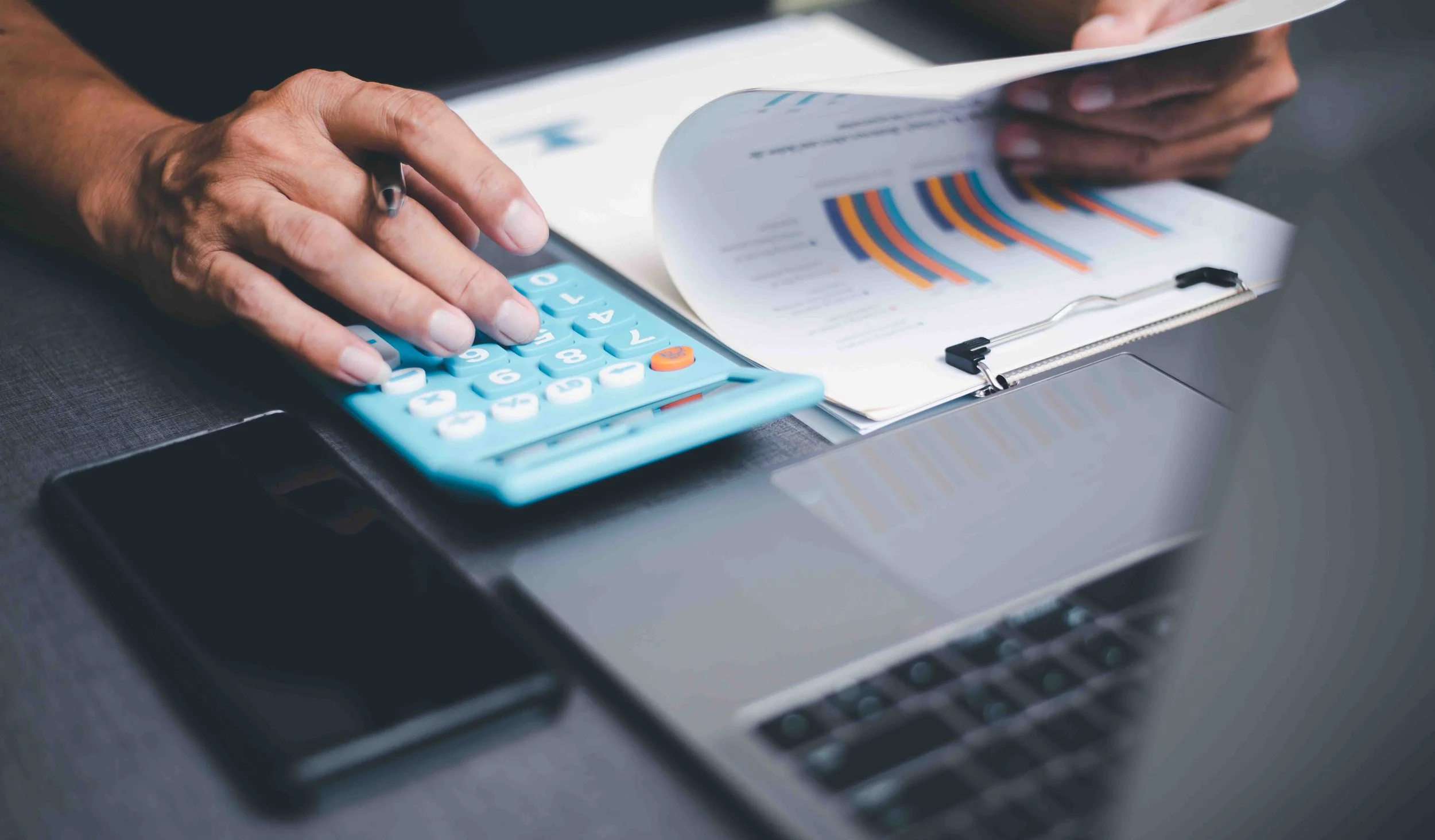 Accountant reviewing paperwork during business tax preparation