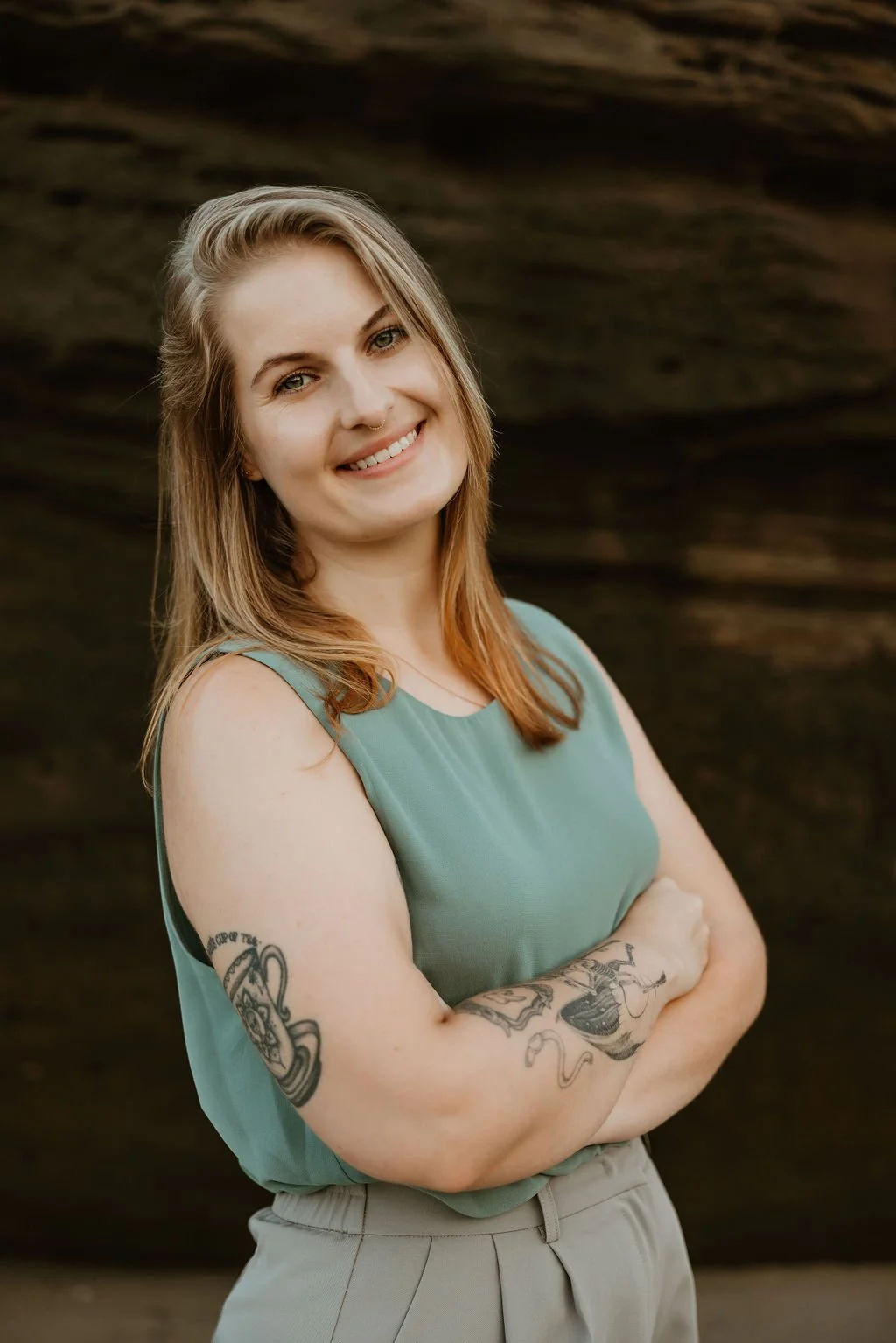 Smiling therapist providing holistic, witchy, and pagan-affirming virtual therapy in Ohio and Kentucky.