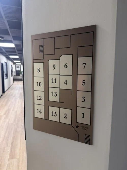 A floor plan layout with numbered rooms from 1 to 15, and the text 'You Are Here' with an arrow pointing near room 1. Hanover Salon suites