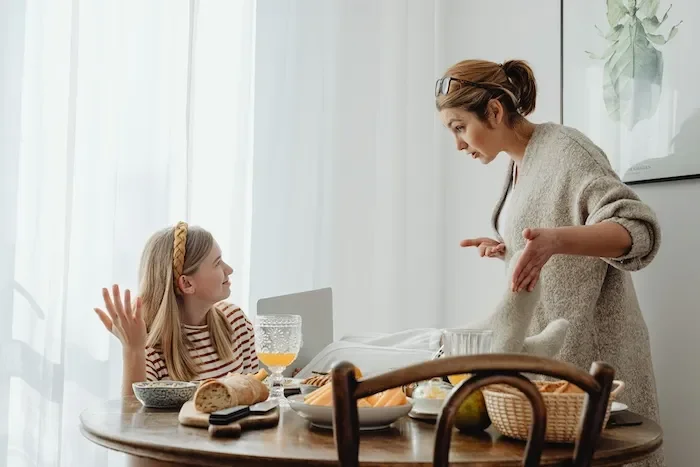 mother and daughter arguing at breakfast