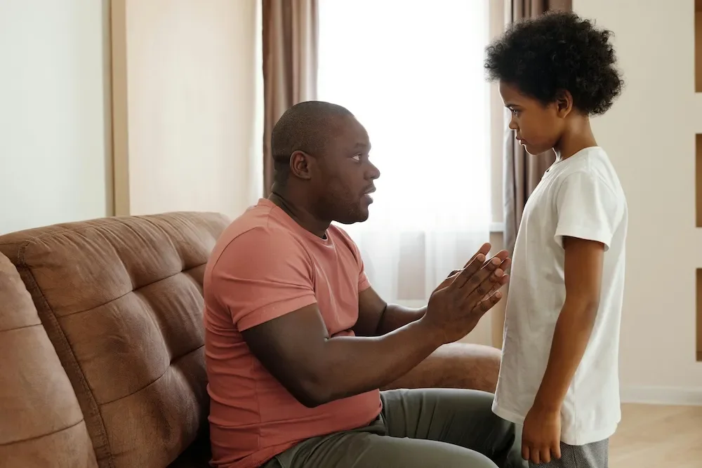 father talking to son