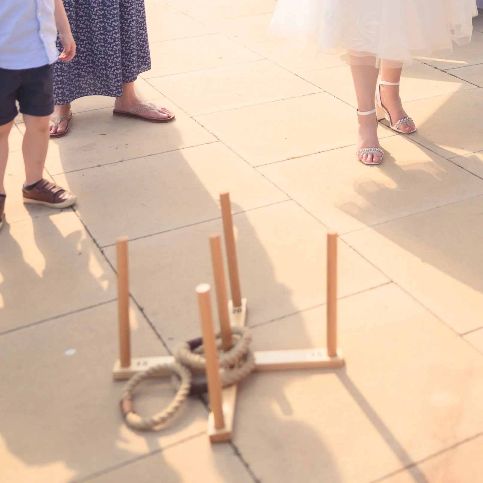 Wooden ring toss game with rope hoops