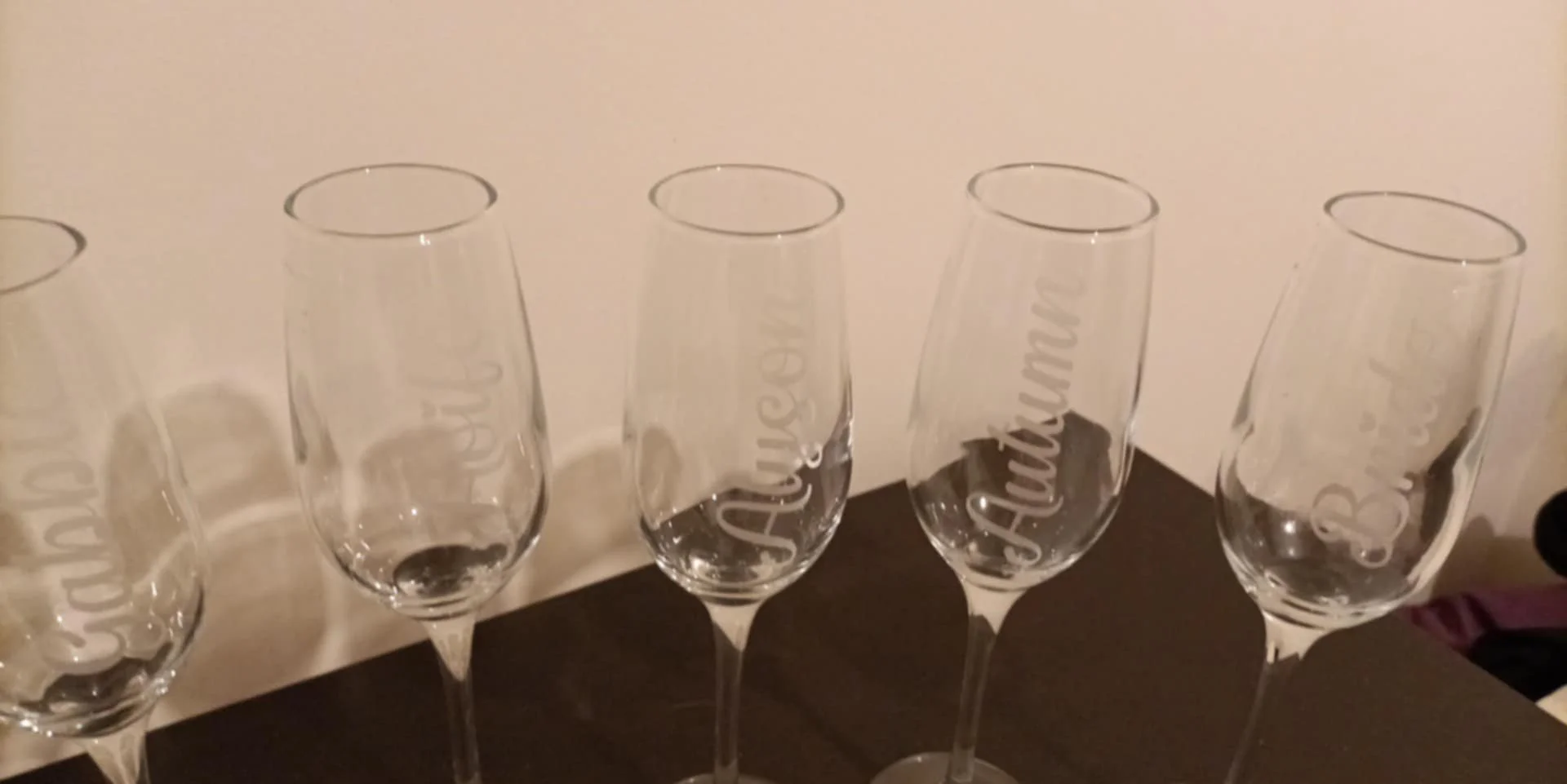 Champagne flute glasses with frosted etched names on them