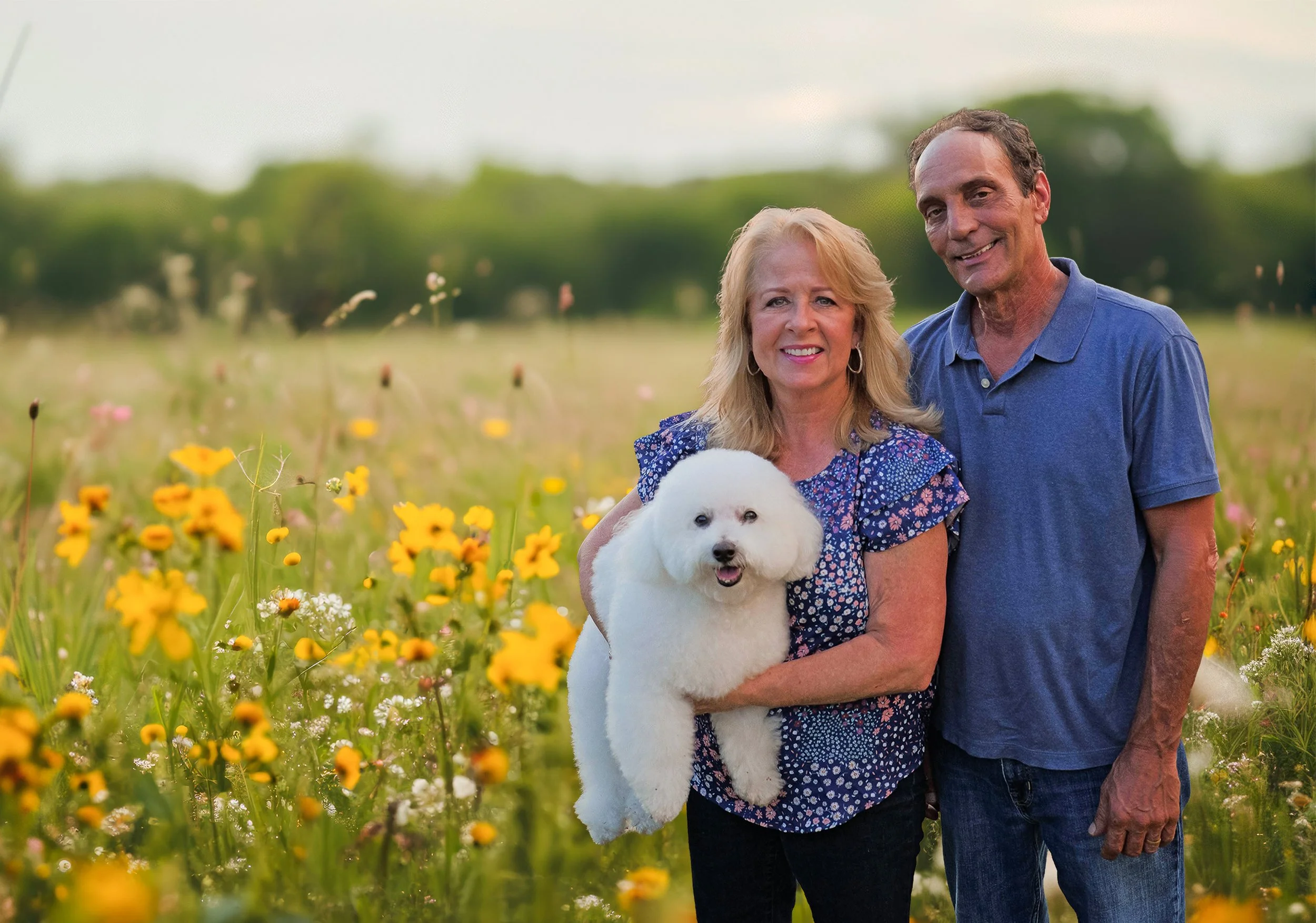 Field of yellow flowers, family and a dog