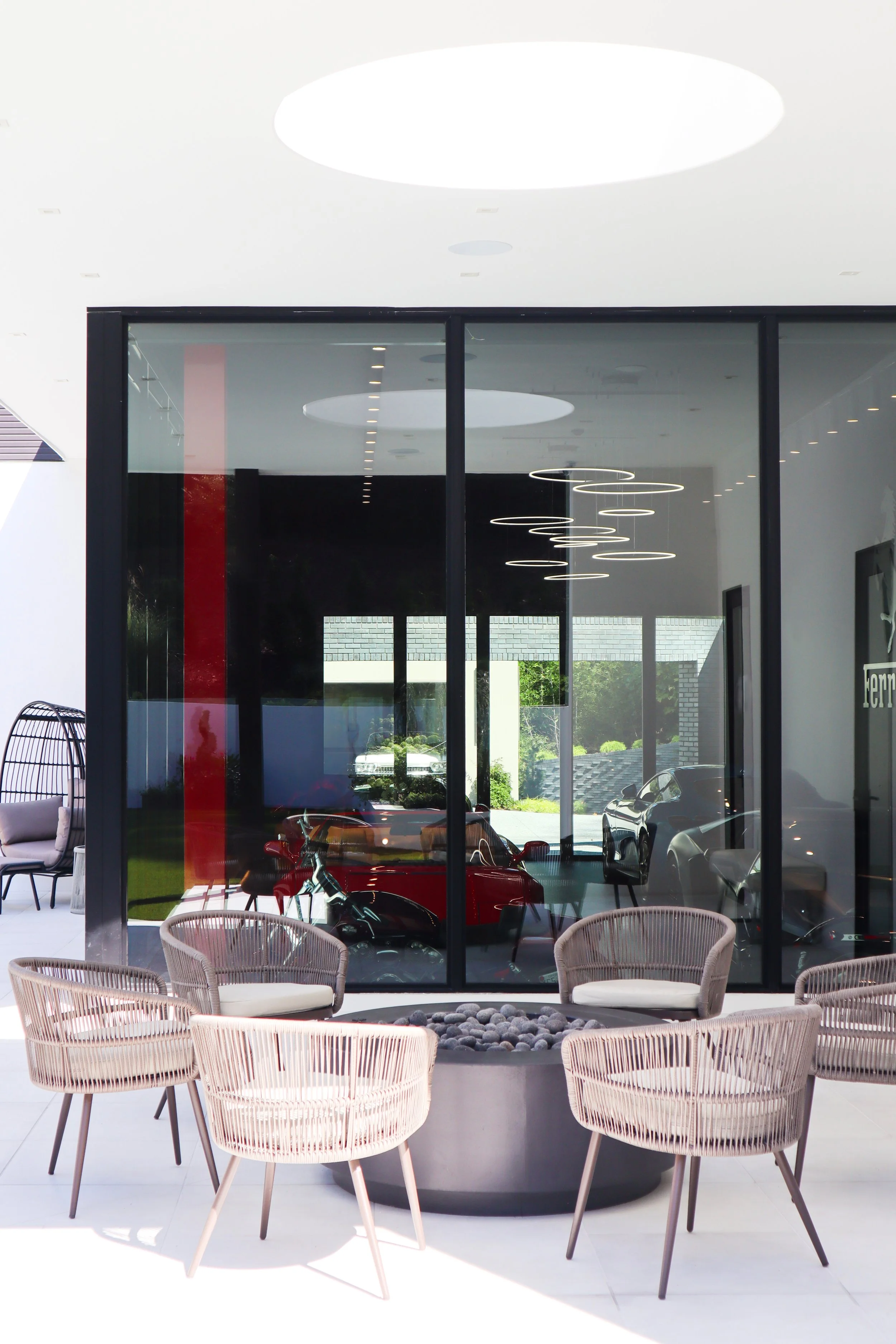 outdoor covered patio overlooking indoor show garage