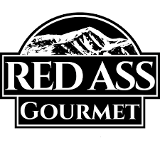 Logo for Red Ass Gourmet with a mountain illustration in black and white.