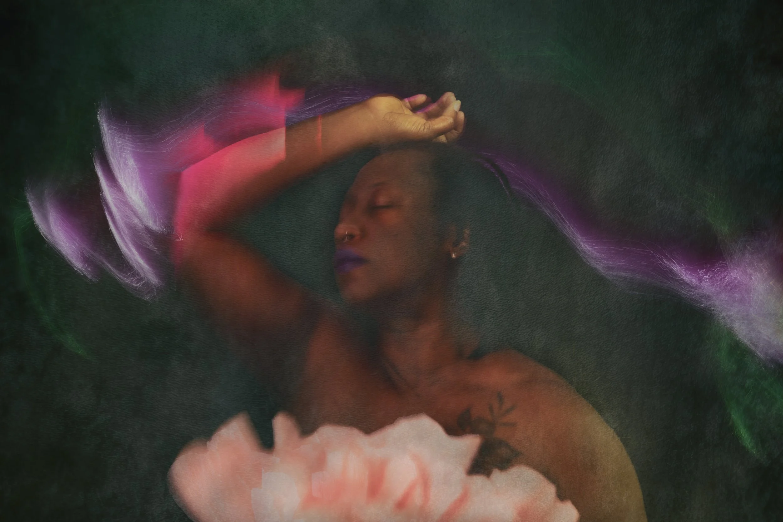 Artistic light painting boudoir portrait by Bellissimo Expressions – woman illuminated by glowing pink, blue and purple light trails with large peony flowers, Fort Walton Beach studio.