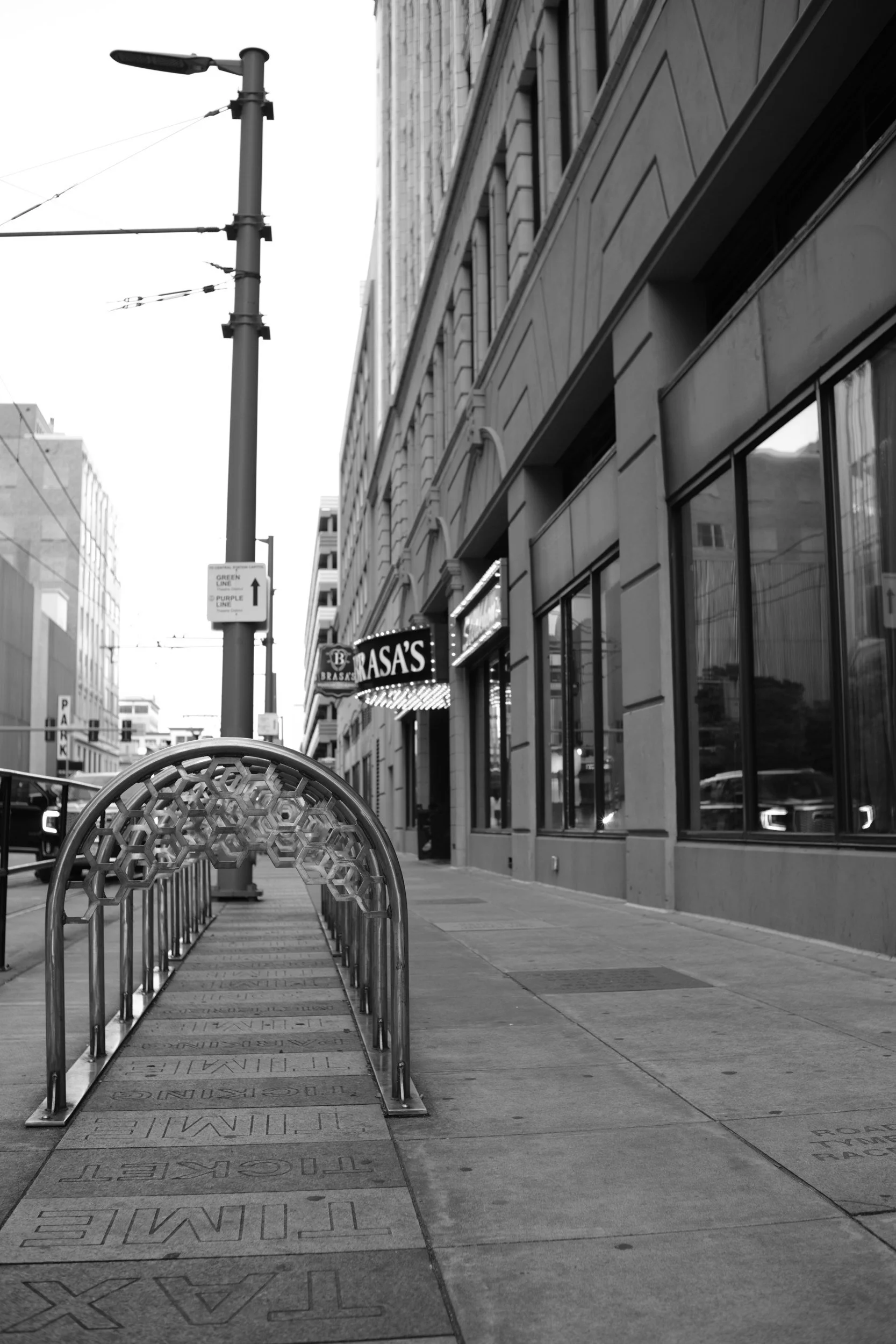 A bike corral drawing a long perspective down Main.