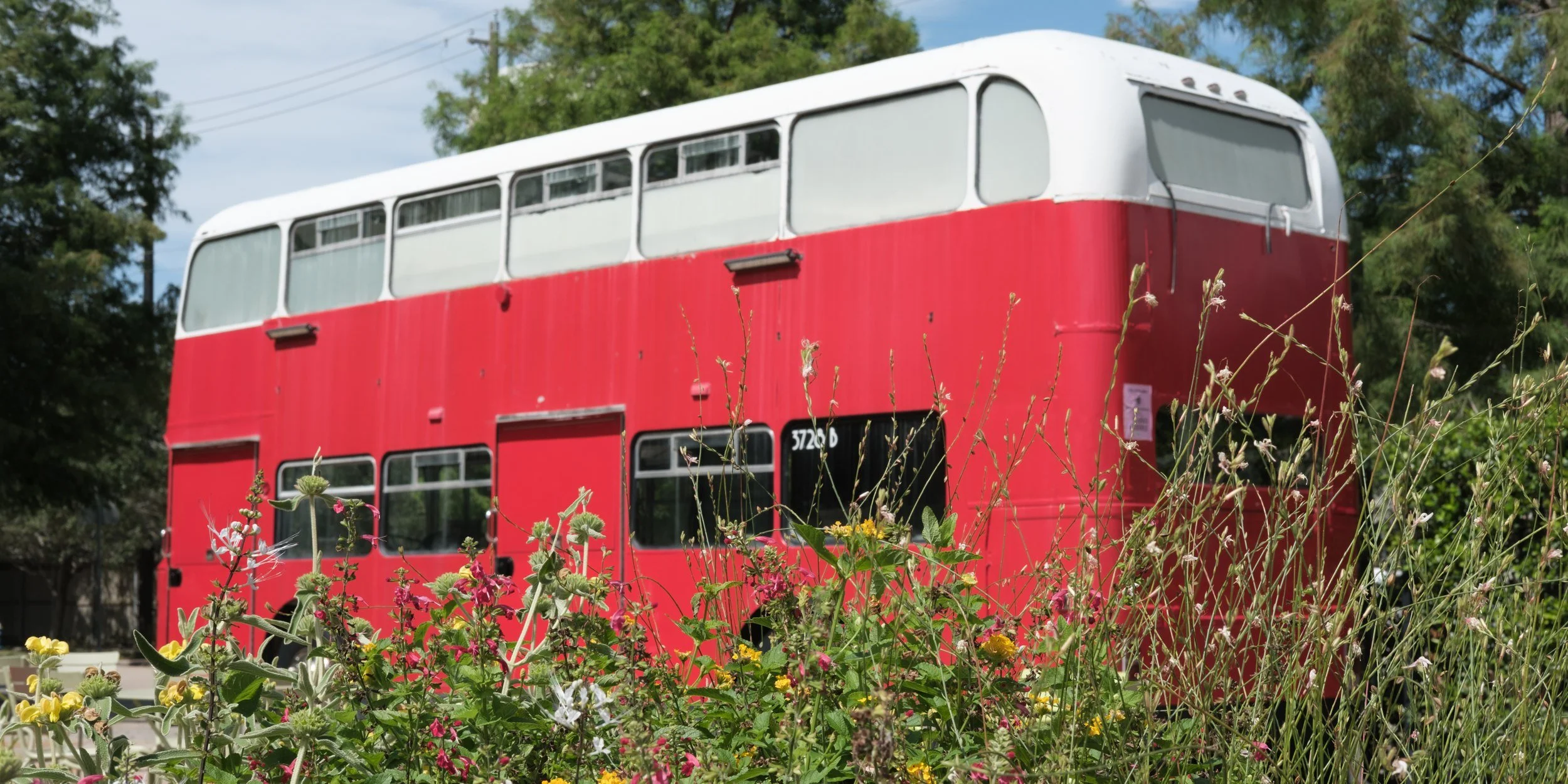 A retired London double-decker slowly becoming part of the landscape.