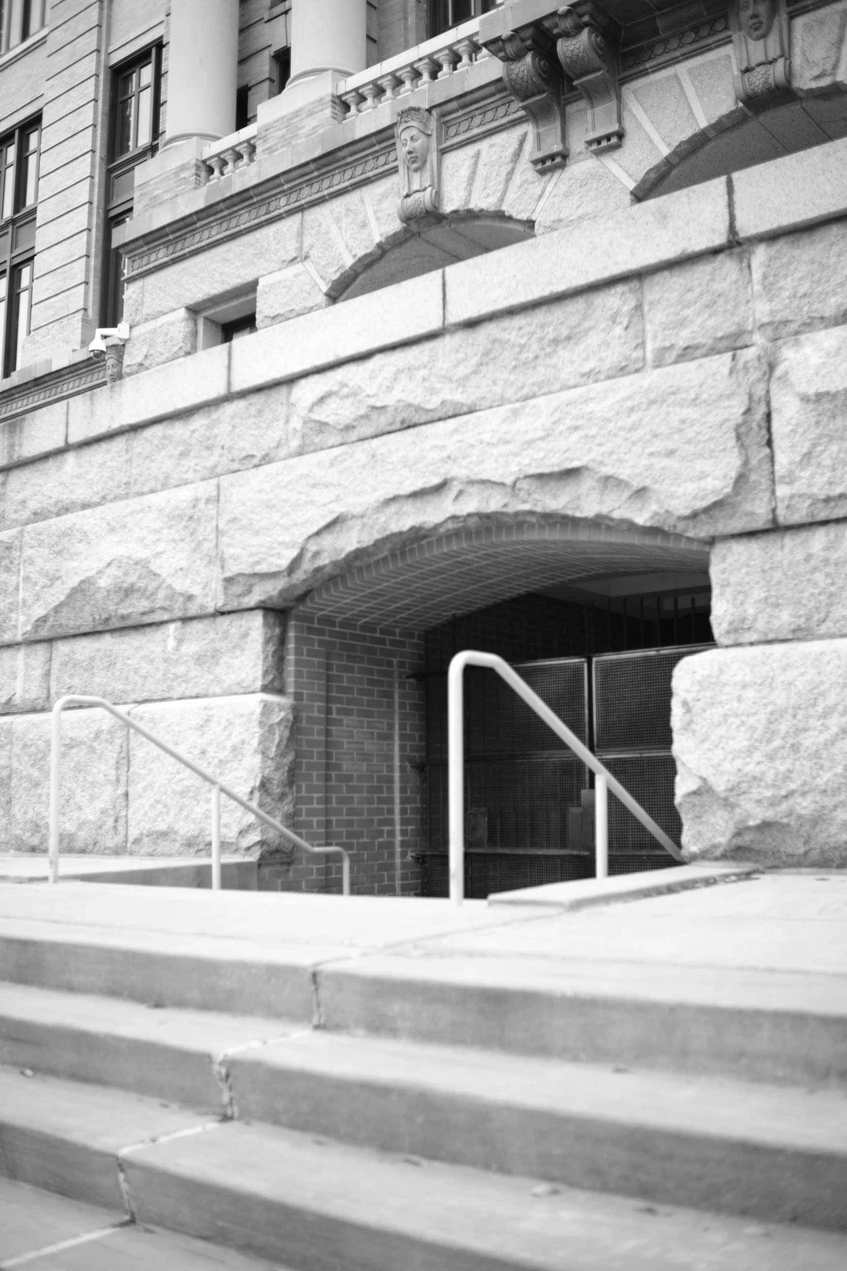 A rusticated stone entrance downtown.