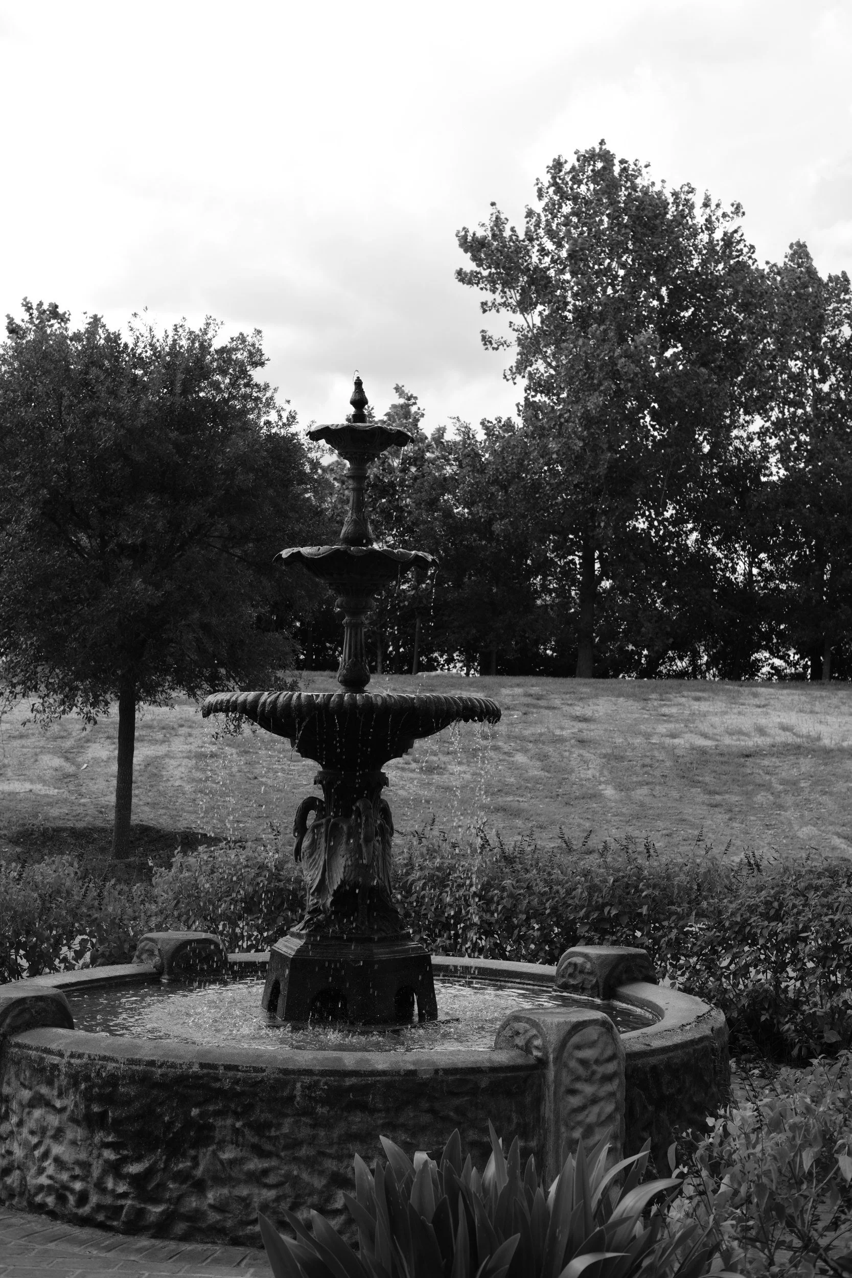 A cast-iron fountain in a quiet park.