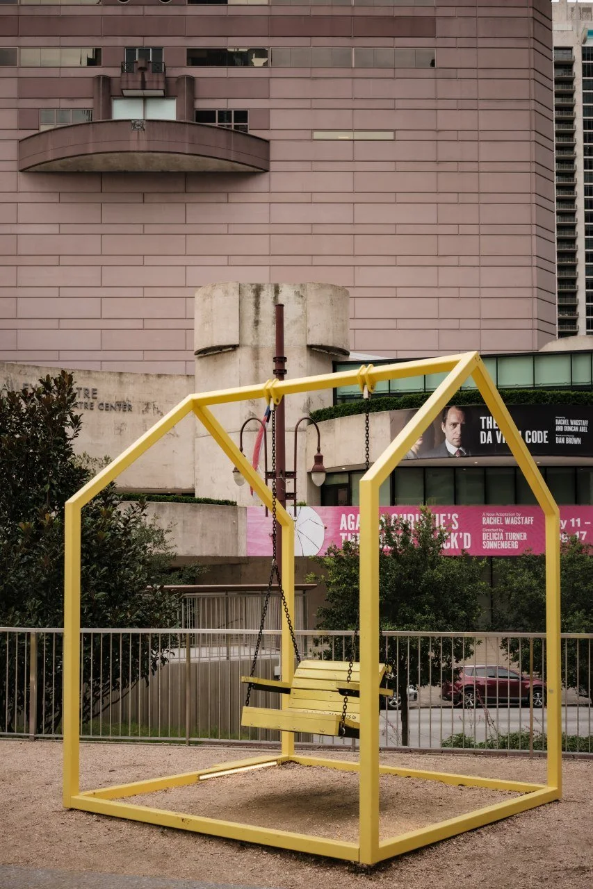 A swing built like the outline of a house at Discovery Green.