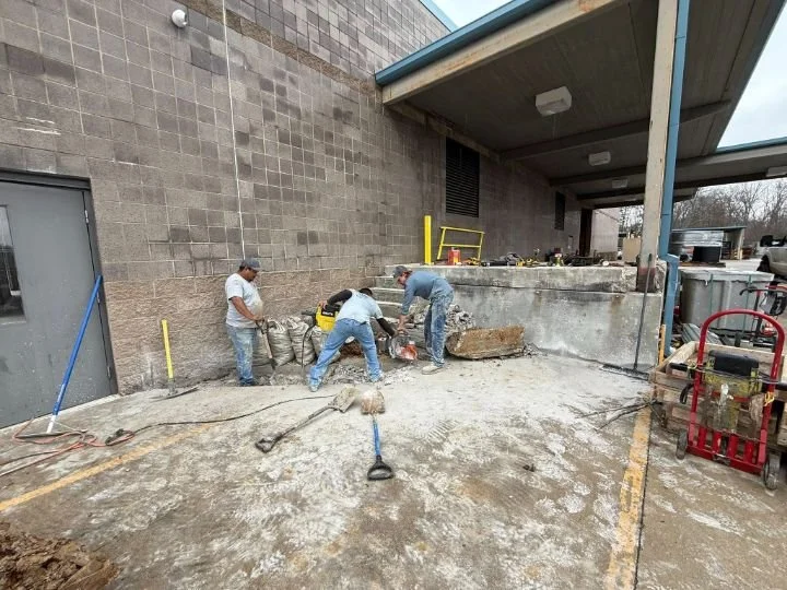 Gillespie Concrete crew demolishing old concrete for loading dock expansion at Ben Lomand Connect in McMinnville TN