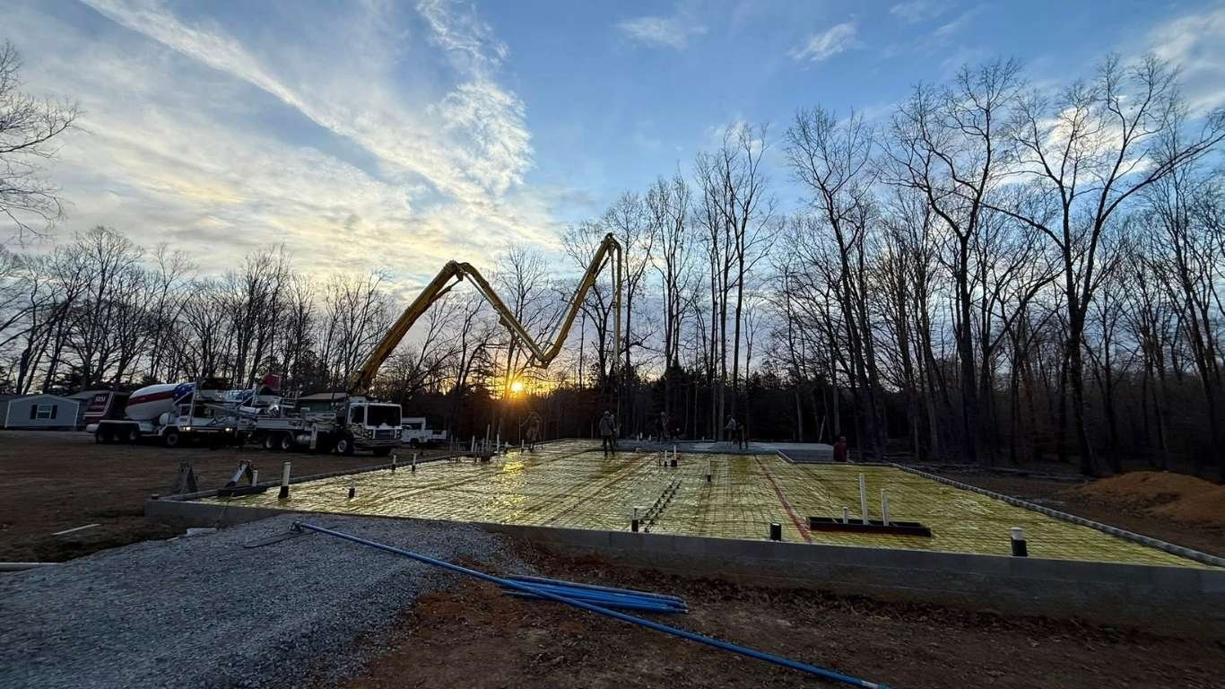 Boom pump truck on residential slab pour job site Liberty Tennessee