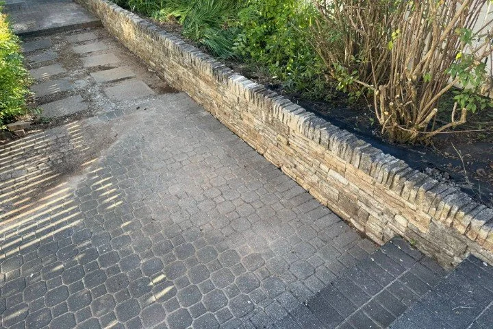 Completed concrete retaining wall along street and sidewalk in Manchester, TN.