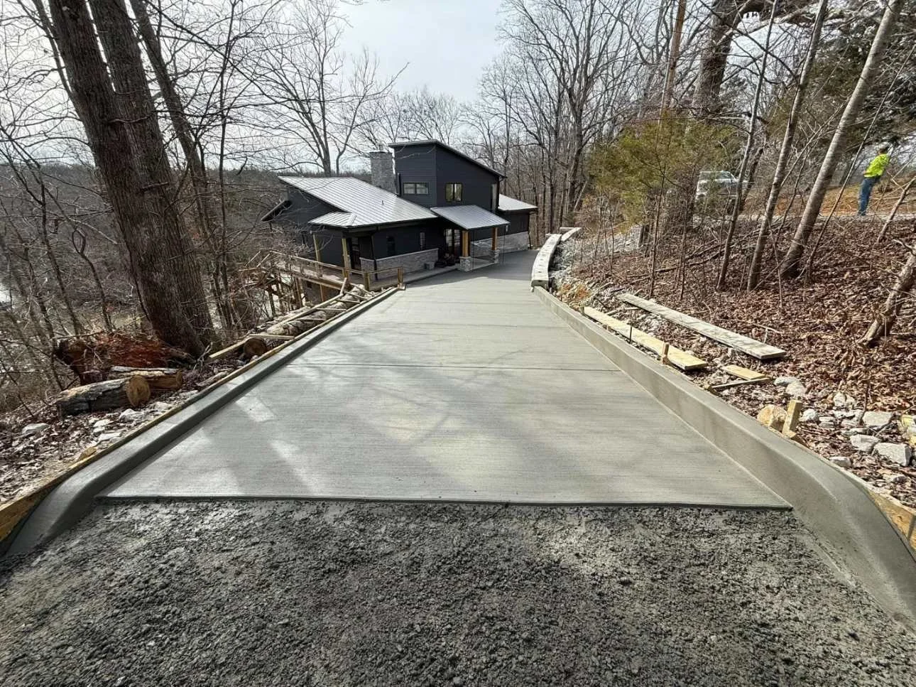 Finished concrete driveway with curbs on hillside lot Rock Island Tennessee