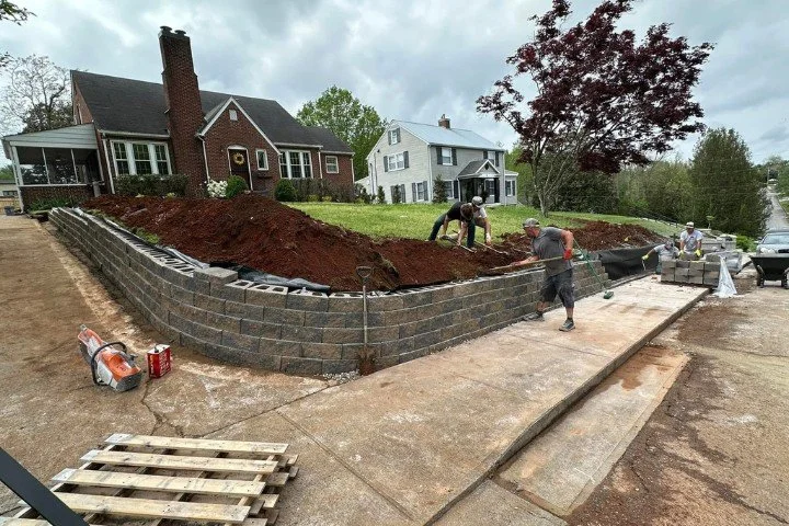 Stone retaining wall alongside garden walkway in Manchester, TN.