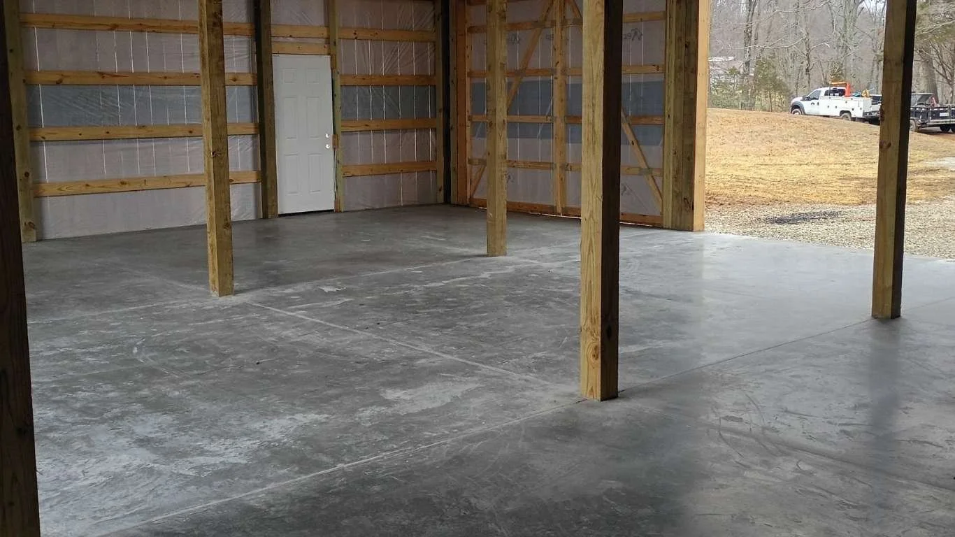 freshly finished concrete slab inside barn structure in Quebeck Tennessee