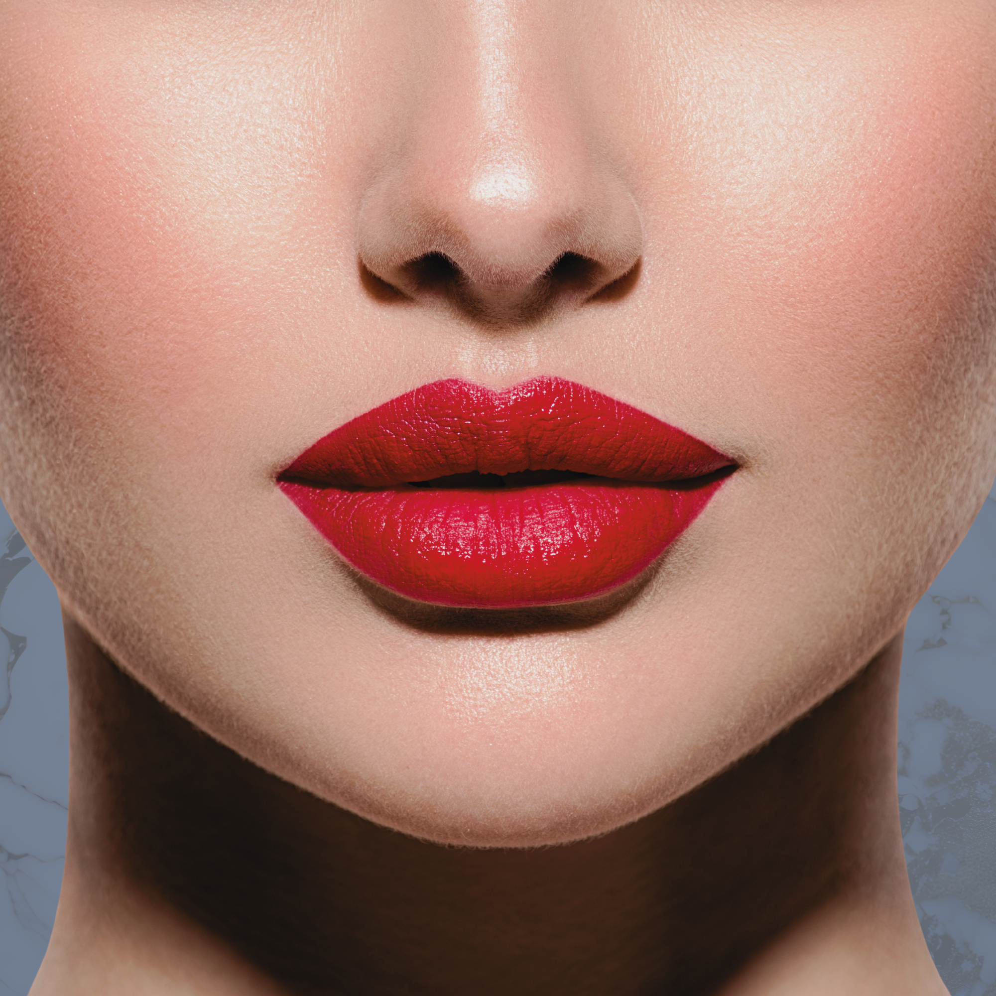 Close-up of a woman's lips with bright red lipstick, part of her nose and chin visible, and smooth skin with faint facial texture.