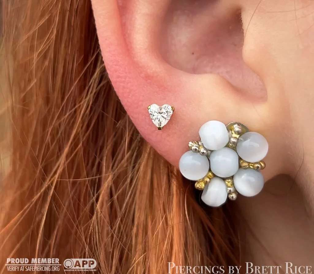 Lobe piercings with a titanium heart shaped CZ and a 4mm bezel CZ @neometaljewelry 

#safepiercing #appmember #terrehautepiercing #midwestpiercer #lobepiercings