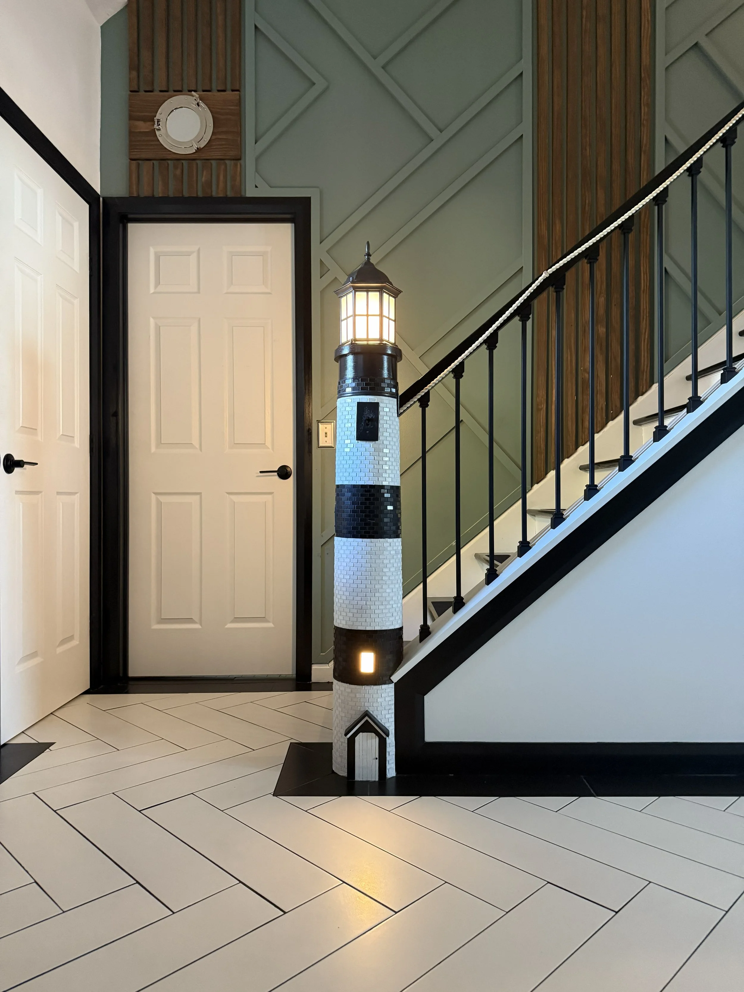 This one-of-a-kind lighthouse feature was fully custom-built to transform an otherwise unused stairwell into a true statement piece. From the detailed tile work and integrated lighting to the handcrafted trim and seamless integration with the stair r