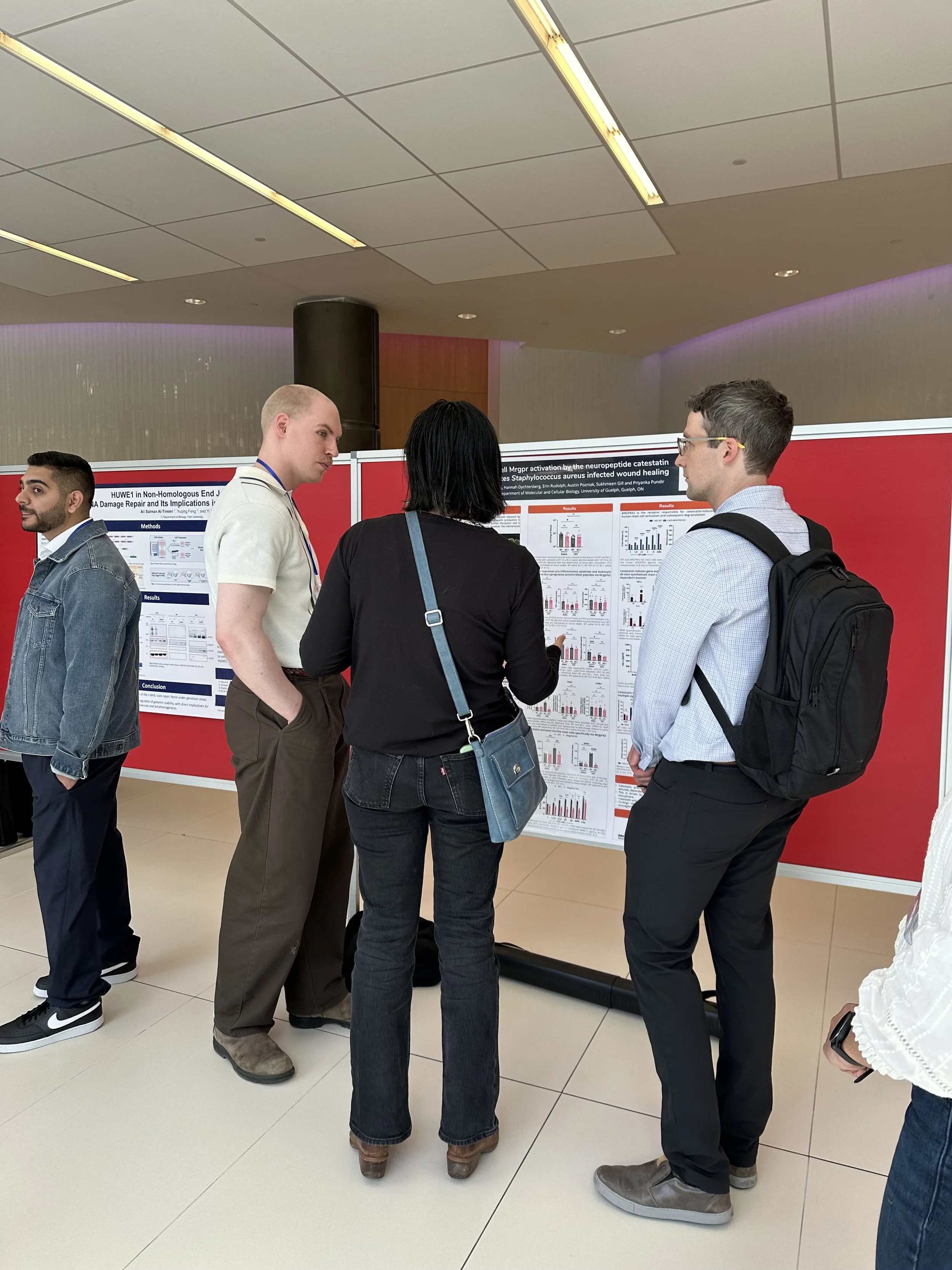 Colin discussing his poster at Immune Synapse Toronto, May 2026