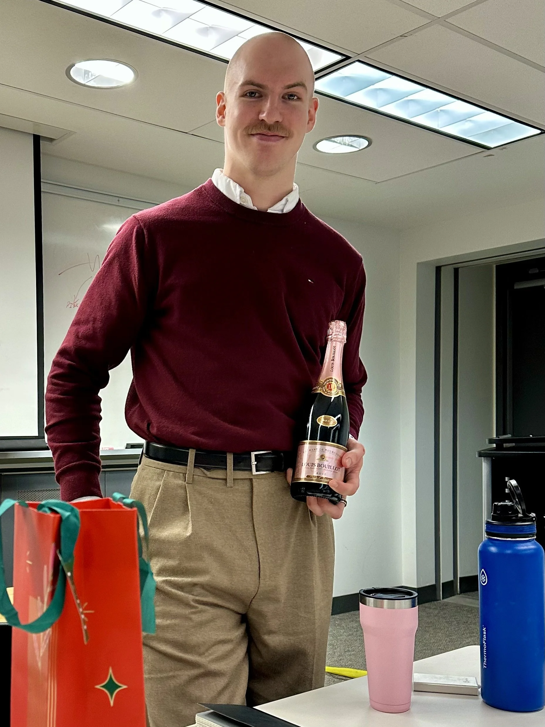 Colin celebrating passing his PhD Qualifying Exam, December 2025