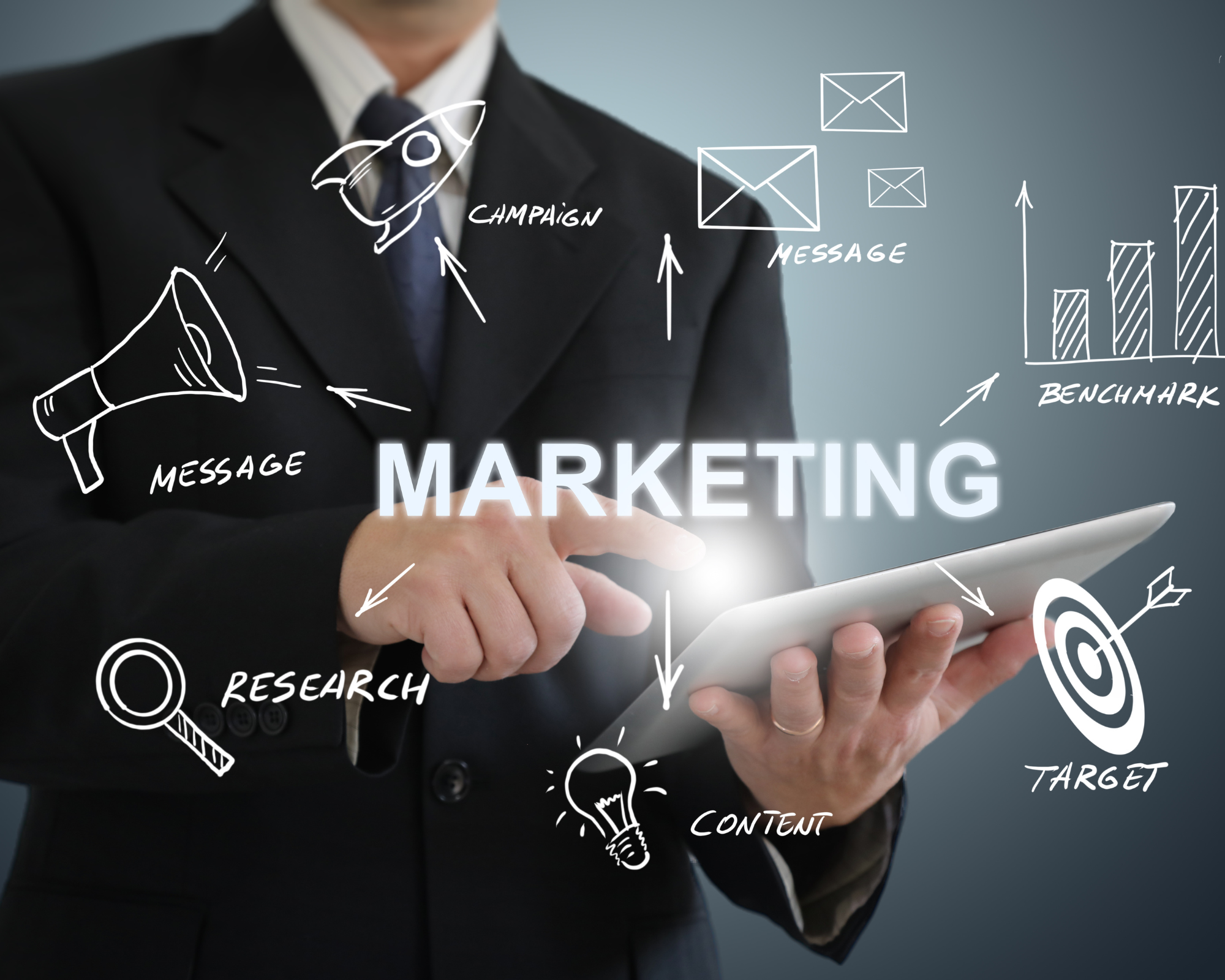 Businessperson in suit using tablet with marketing concept diagrams and words like campaign, message, research, content, target, and objective overlayed in a digital illustration.