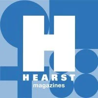 The Heart's Magazines logo featuring a large white 'H' and the word 'HEARTS' in white capital letters below, set against a blue background with circular shapes.