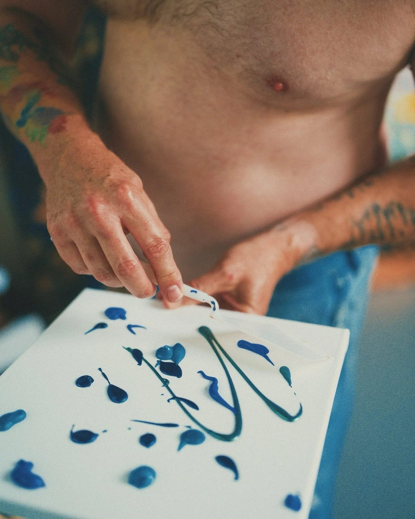 The Artist. 
Creating art with nothing but raw emotion and a bit of blue. 🎨✨ Sometimes the canvas isn&rsquo;t the only thing that gets painted.
Concept and photography by me @spilledmilkphoto 
Featuring @fit.dad69 
Big big thank you to Todd for part