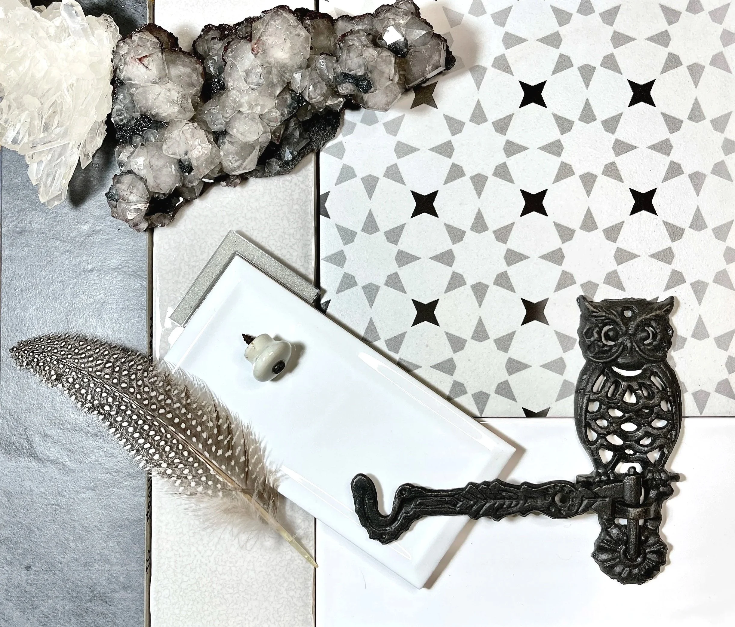 Bathroom mood board with a base of star pattern tile, white beveled subway tile, slate tile.  Layered with rock crystals, glitter grout, antique knob, and wrought iron owl hook.  Designed and photographed by Sara Trotter / Chroma Maison Design.