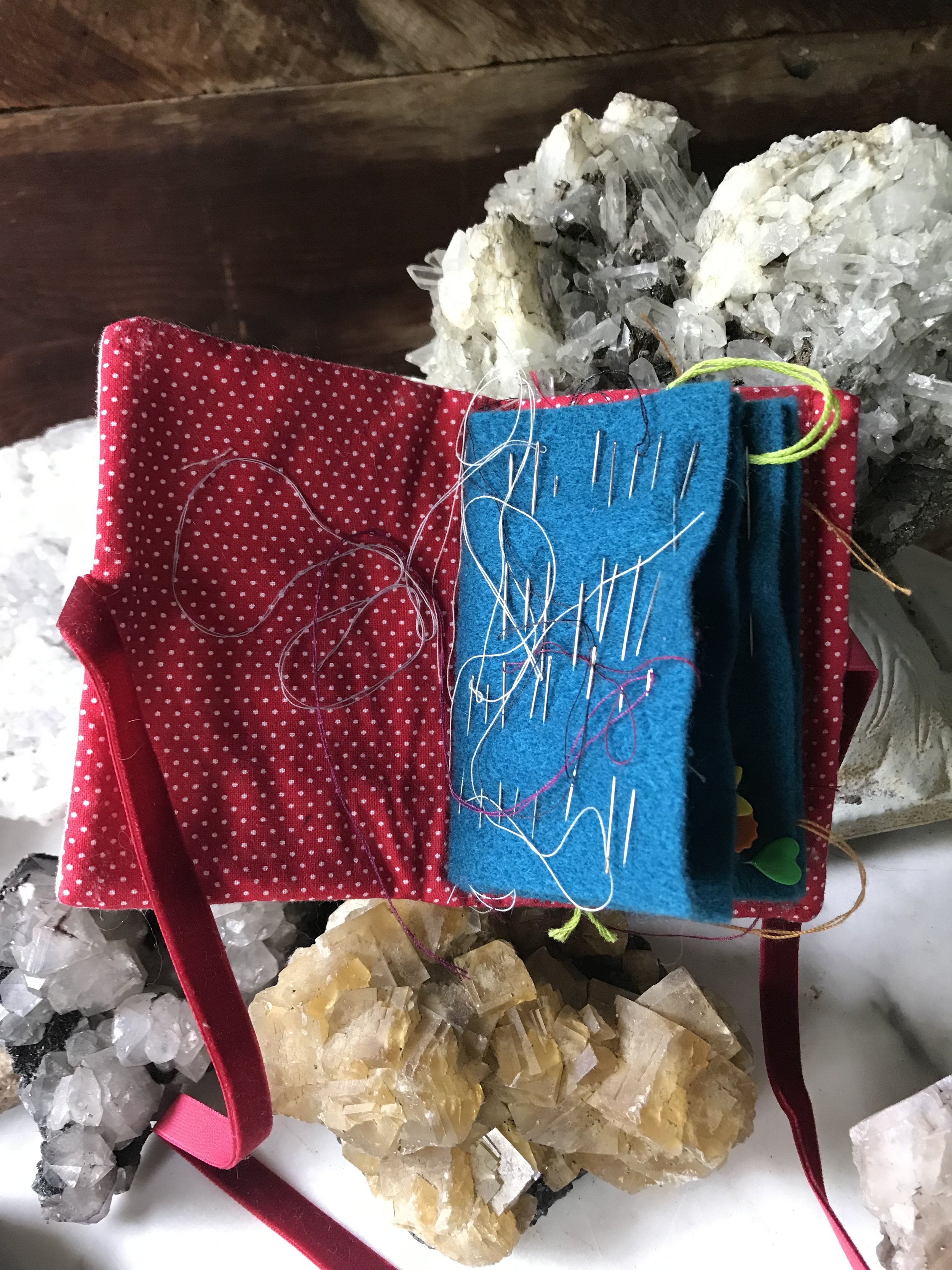 Miss Scarlet (1960's Clue) embroidered needle case for sewing shown open with needles and thread, designed and made by artist Sara Trotter / Chroma Maison Design.