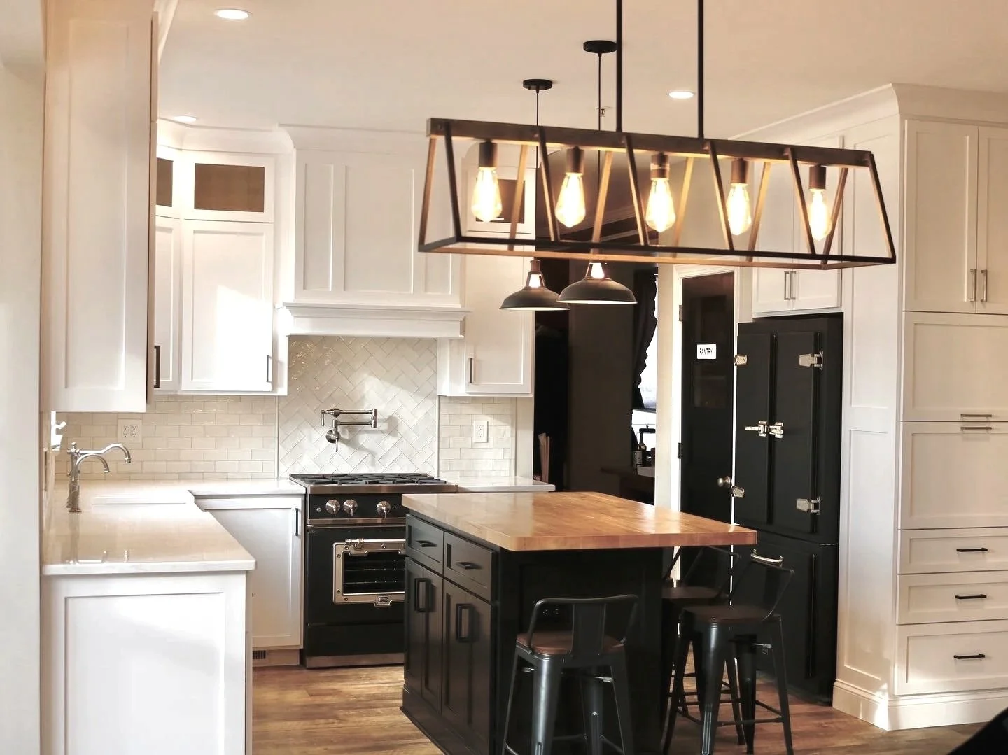 White farmhouse kitchen showcasing antique inspired matte black Big Chill appliances, designed and photographed by Sara Trotter / Chroma Maison Design.