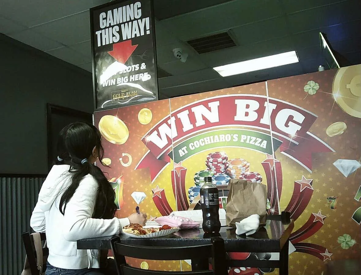 Cochiaros is home to slots and stuff also doubles as a pizza place. Many students come here to hangout. Mixed the innocence of a pizza place with gambling. Though minors aren't allowed back there, there's exposure.