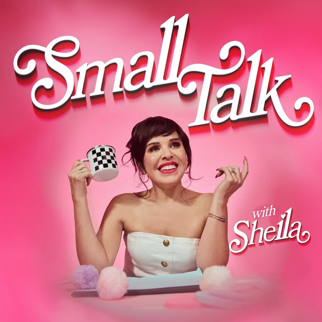 Sheila Kazan sits at a desk with a cup of coffee, ready to share about her life. The title for the podcast, "Small Talk with Sheila" surrounds her.