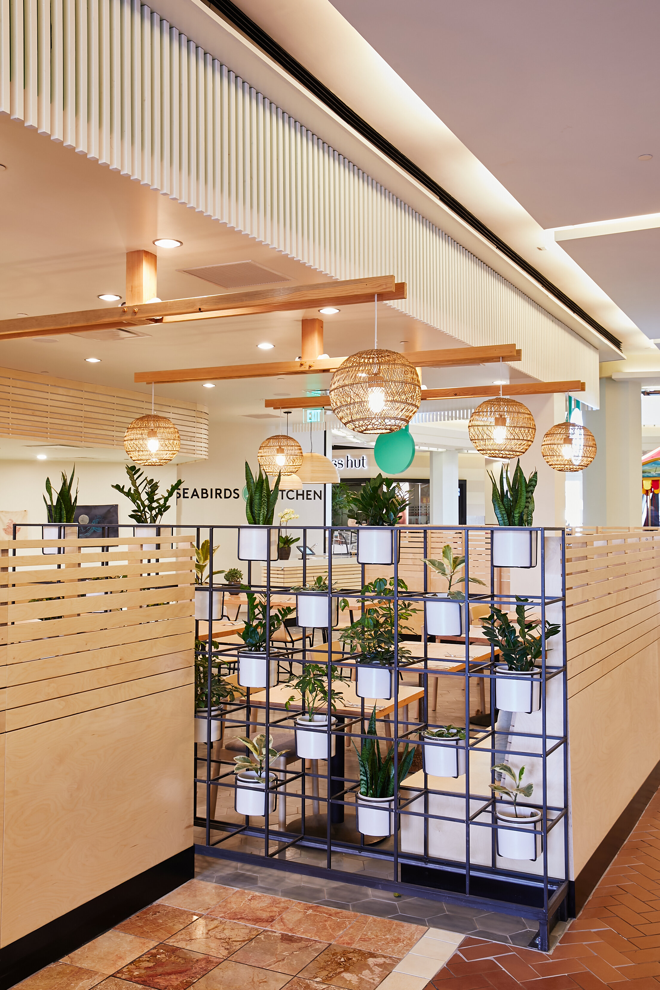 Architecture of Seabirds Kitchen restaurant in Costa Mesa, plant partition