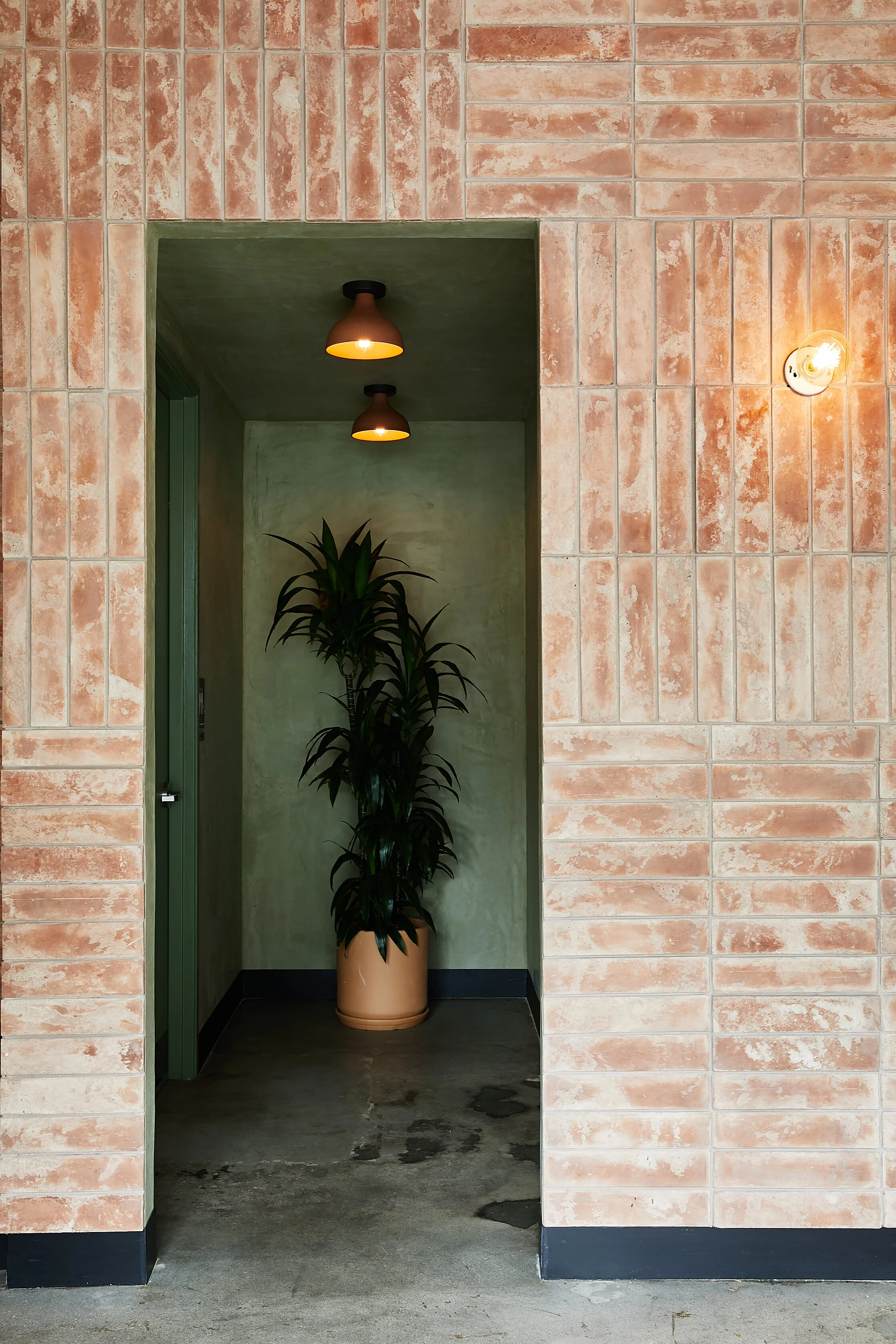 Architecture of Loqui restaurant in downtown L.A., brick wall and hallway