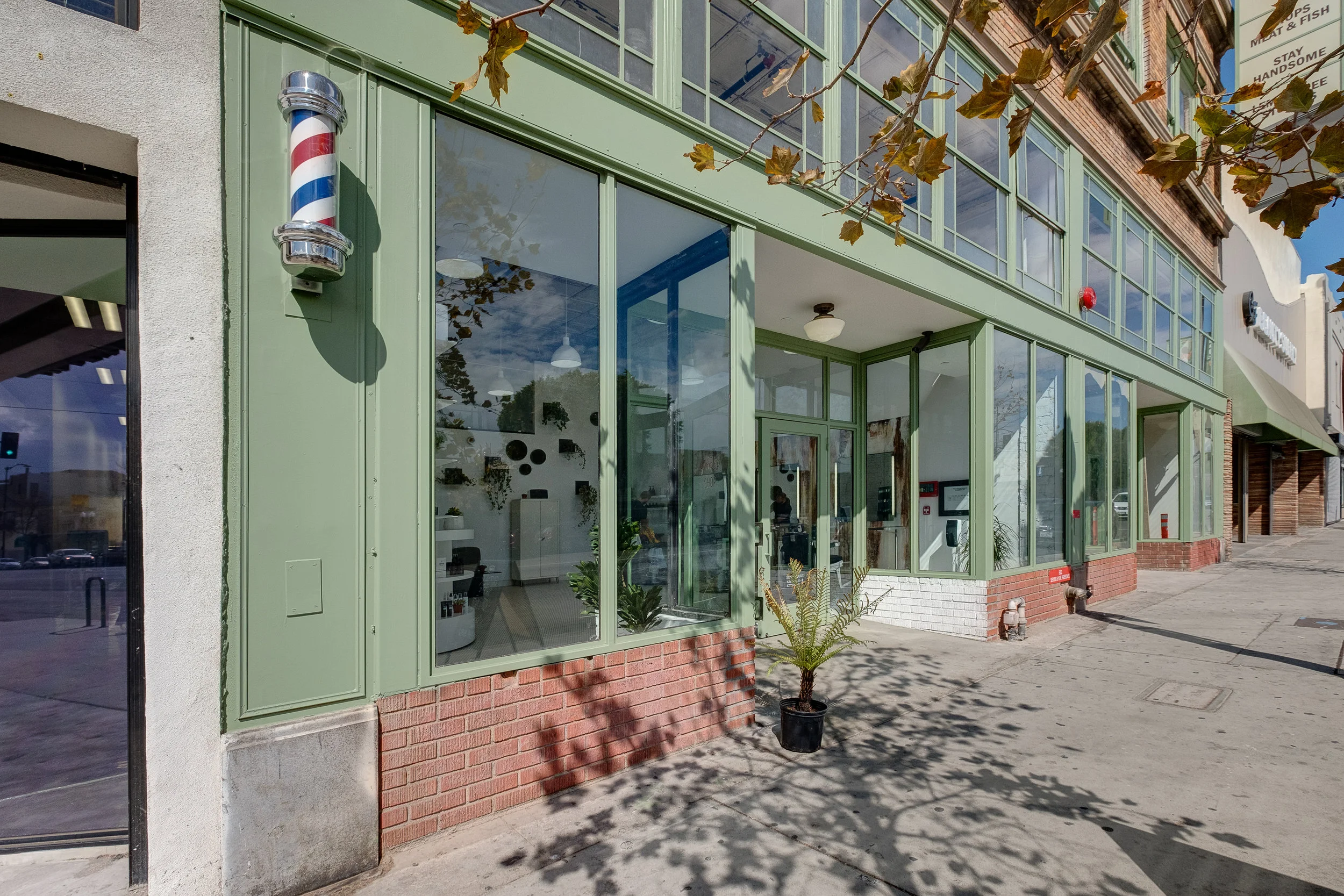 Architecture and renovation of Frank's Building in Highland Park, facade of Blind Barber