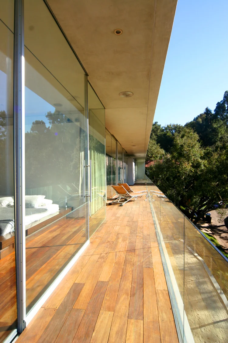 Architecture and design of residence designed to protect trees and to maximize views and breezes in Benedict Canyon. Balcony view