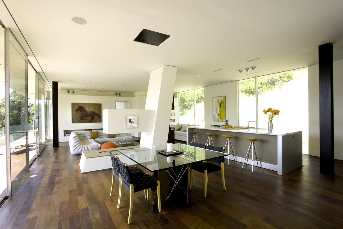 Architecture and design of residence designed to protect trees and to maximize views and breezes in Benedict Canyon. Open floor plan with glass paneled walls.