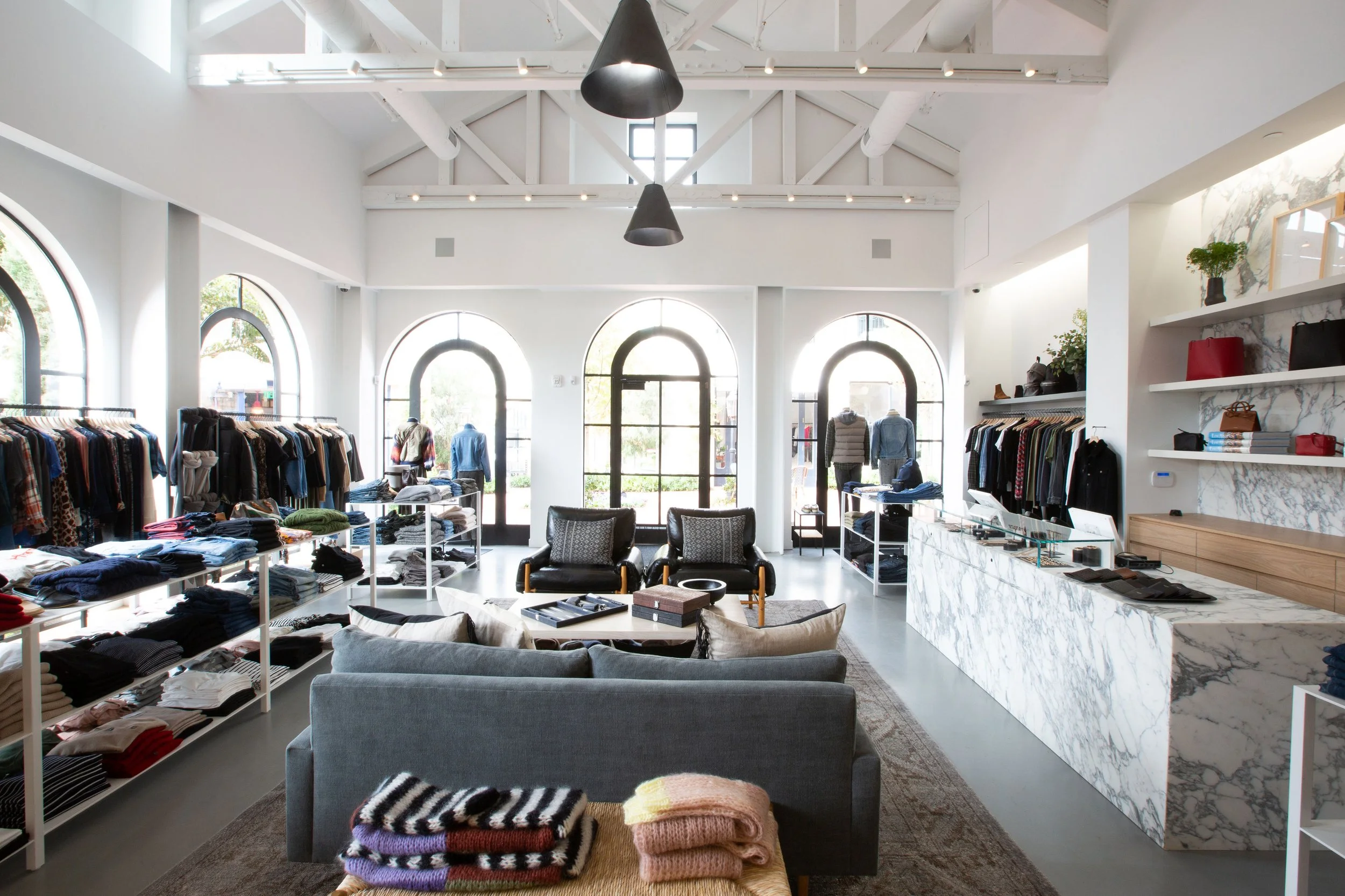 Architecture and design for Towne by Elyse Walker in Pacific Palisades, clothing displays, lounge seating, payment counter