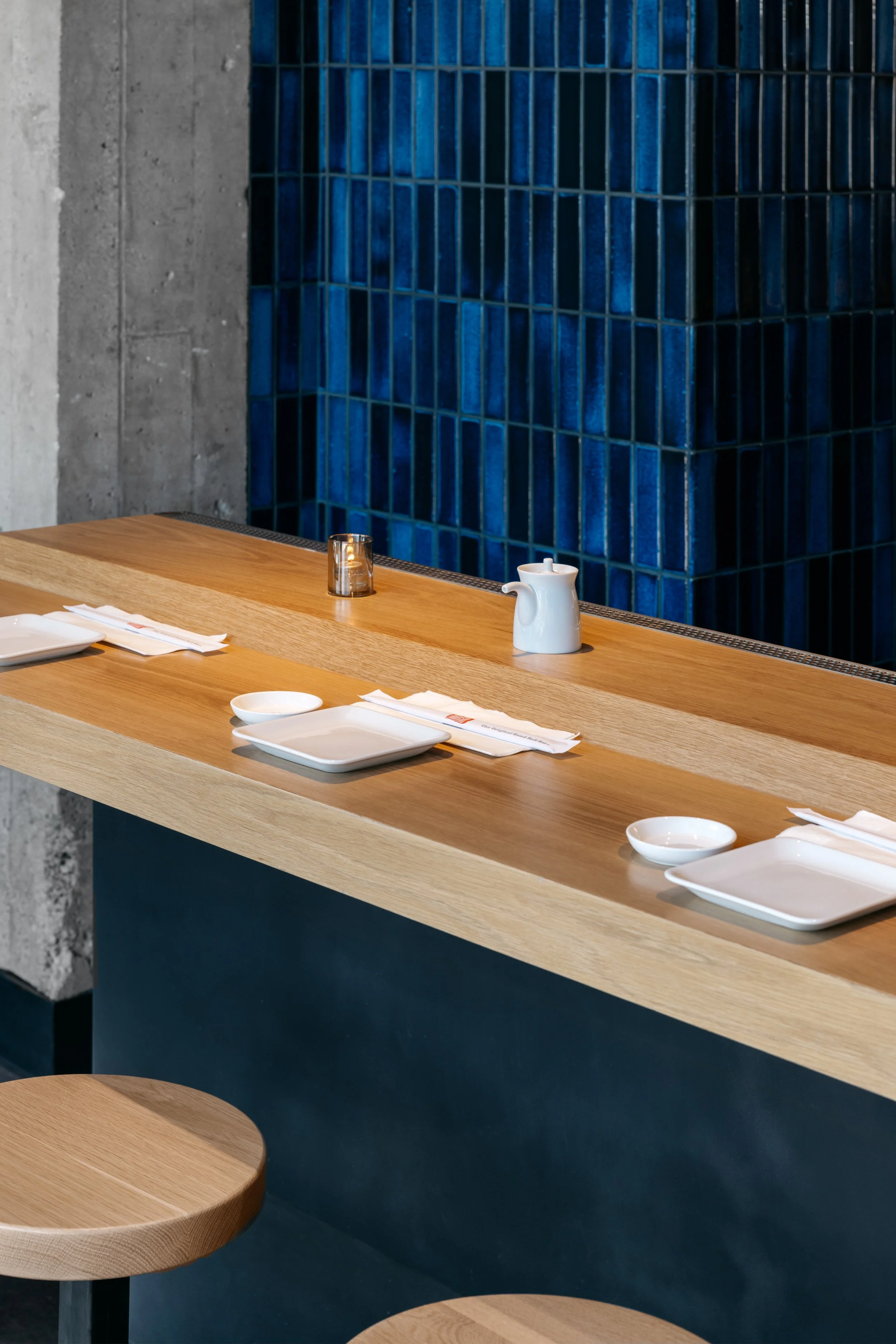 Architecture of KazuNori handroll bar in Chapman Market, Koreatown, bar seating, blue tile