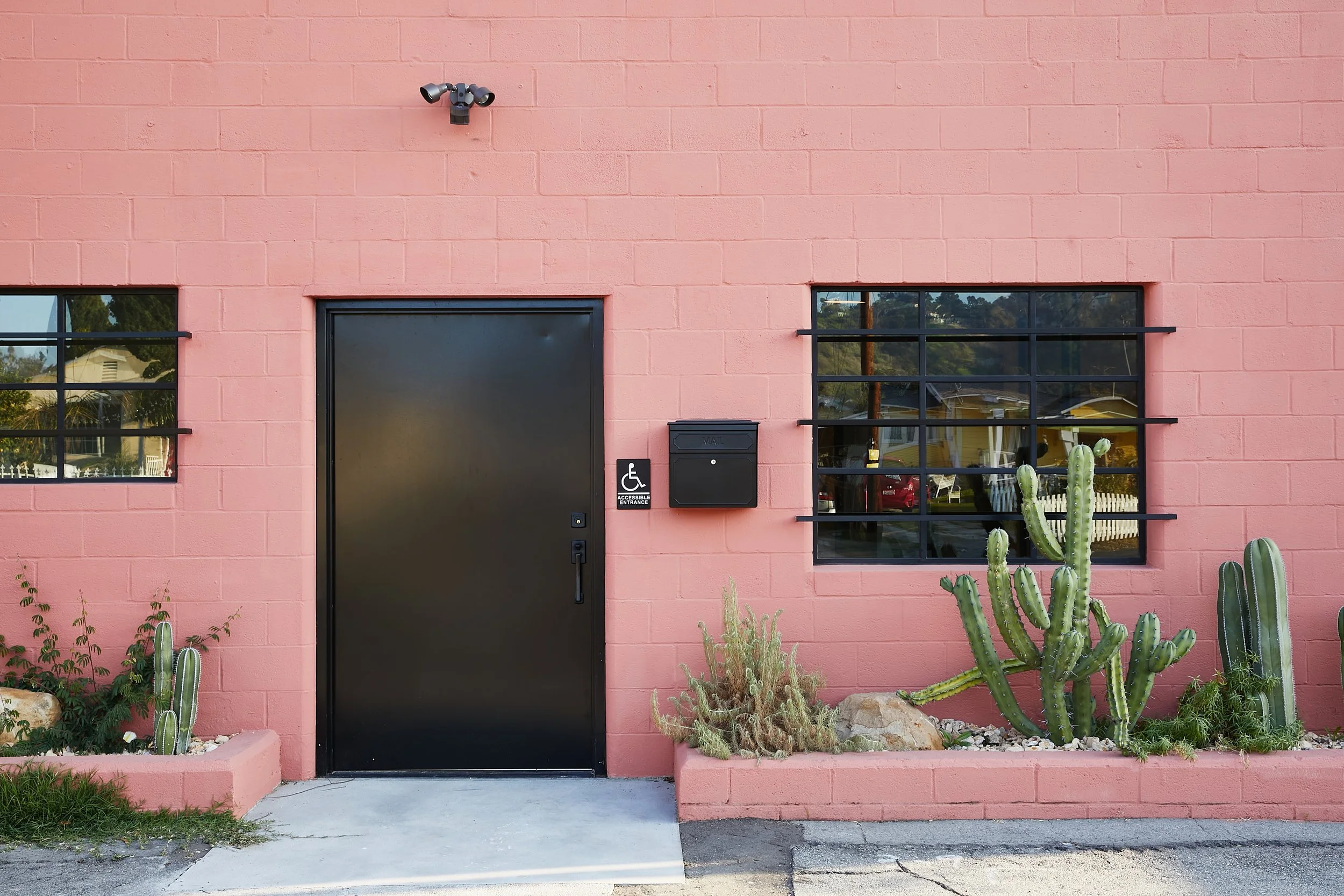 Architecture and design for Lazy Eye office, CMU renovation in Frogtown, pink facade