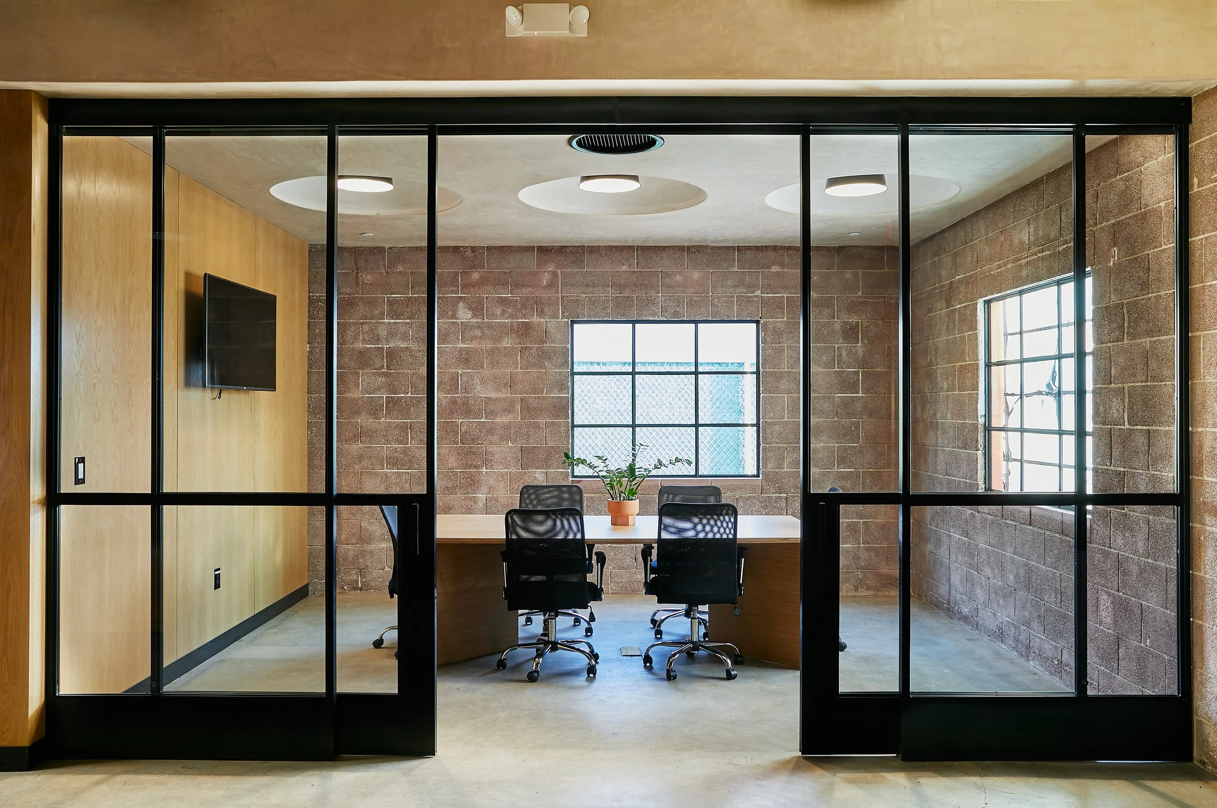 Architecture for Lazy Eye office, CMU renovation in Frogtown, conference room with steel framed doors