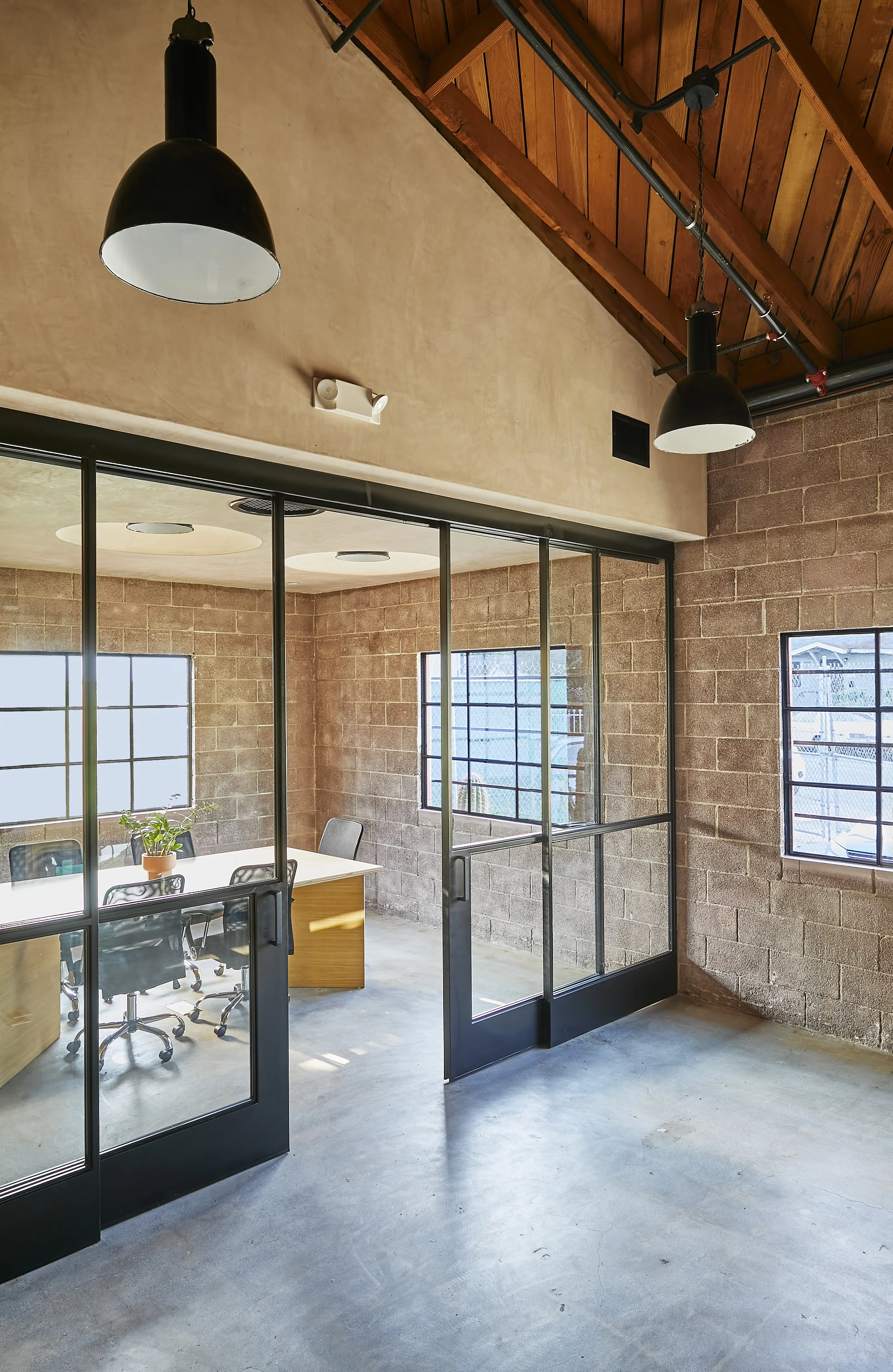 Architecture for Lazy Eye office, CMU renovation in Frogtown, conference room with steel framed doors