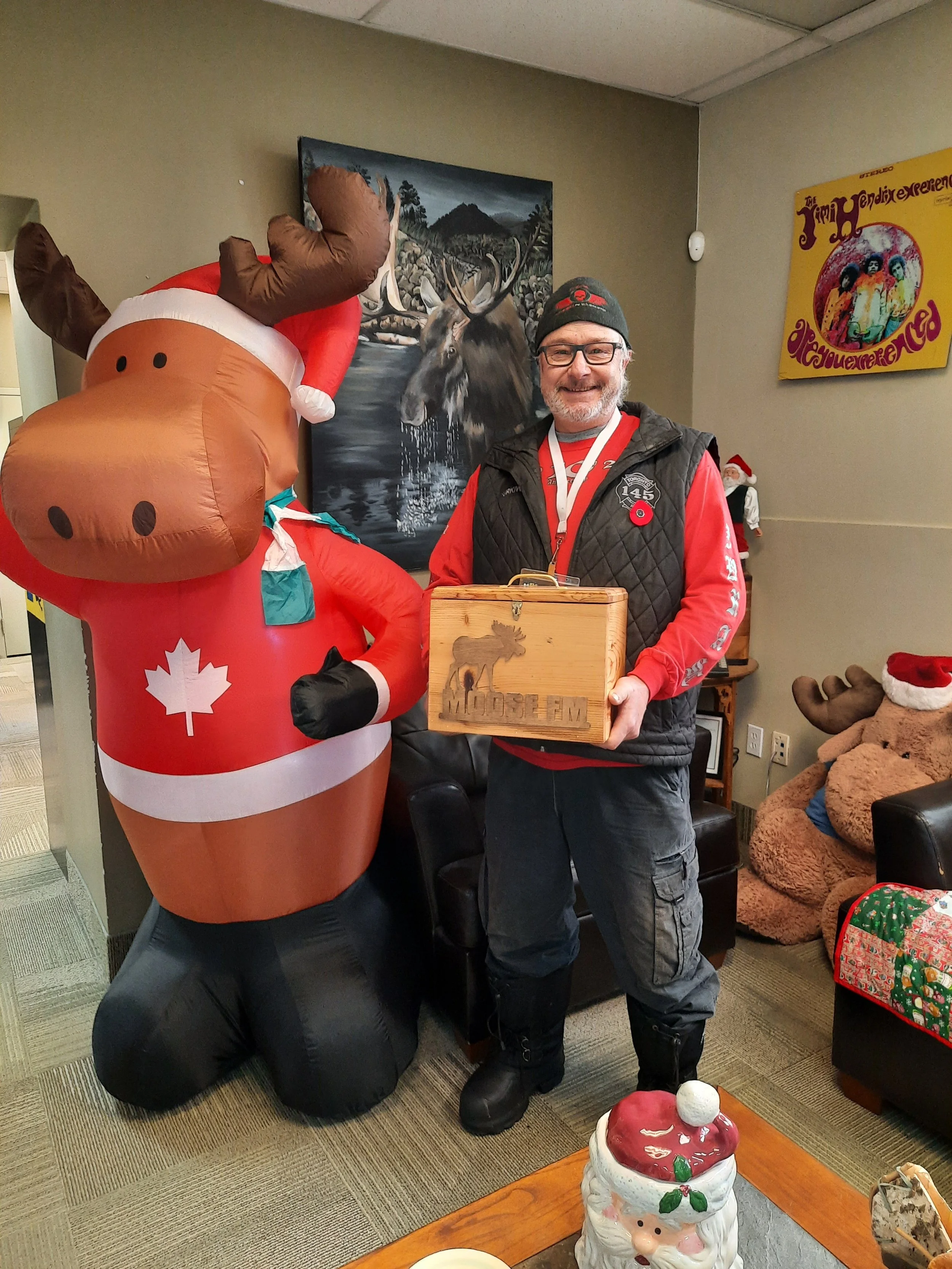 Firefighter Steve dropping off donations at MooseFM.
