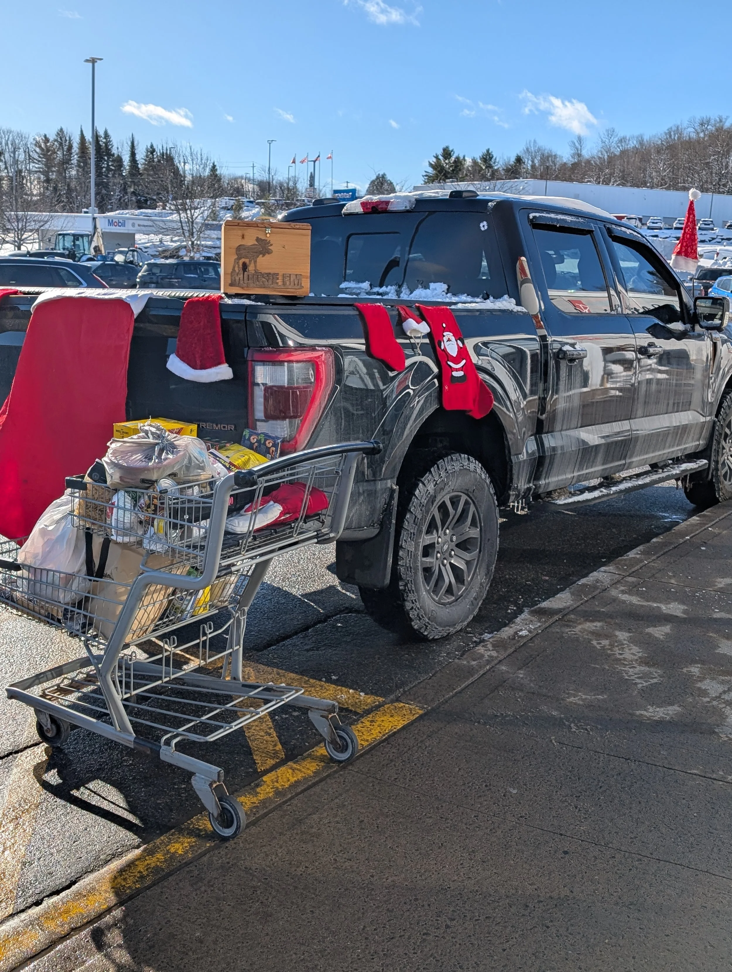 Firefighter Steve setup at the Todd's Independent Grocer in Haliburton collecting donation as part of the 93.5 Moose FM Radiothon