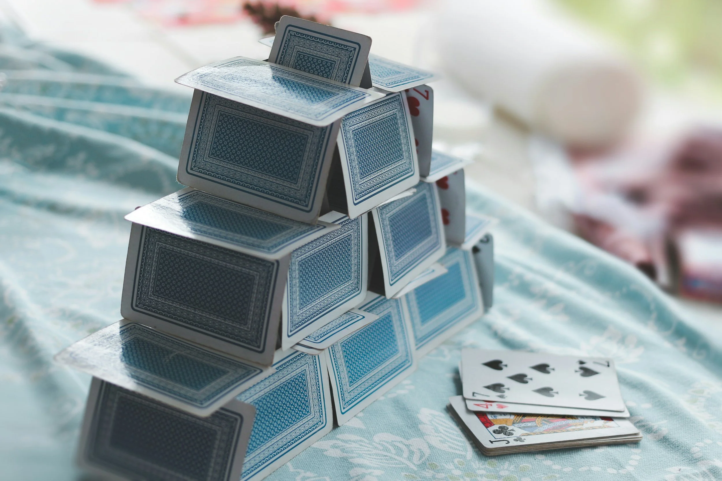 One Fallacy for Each Religion That Can Bring Down the Entire House of Cards - A Mahakali Tribunal Essay on the Load-Bearing Claims of Faith