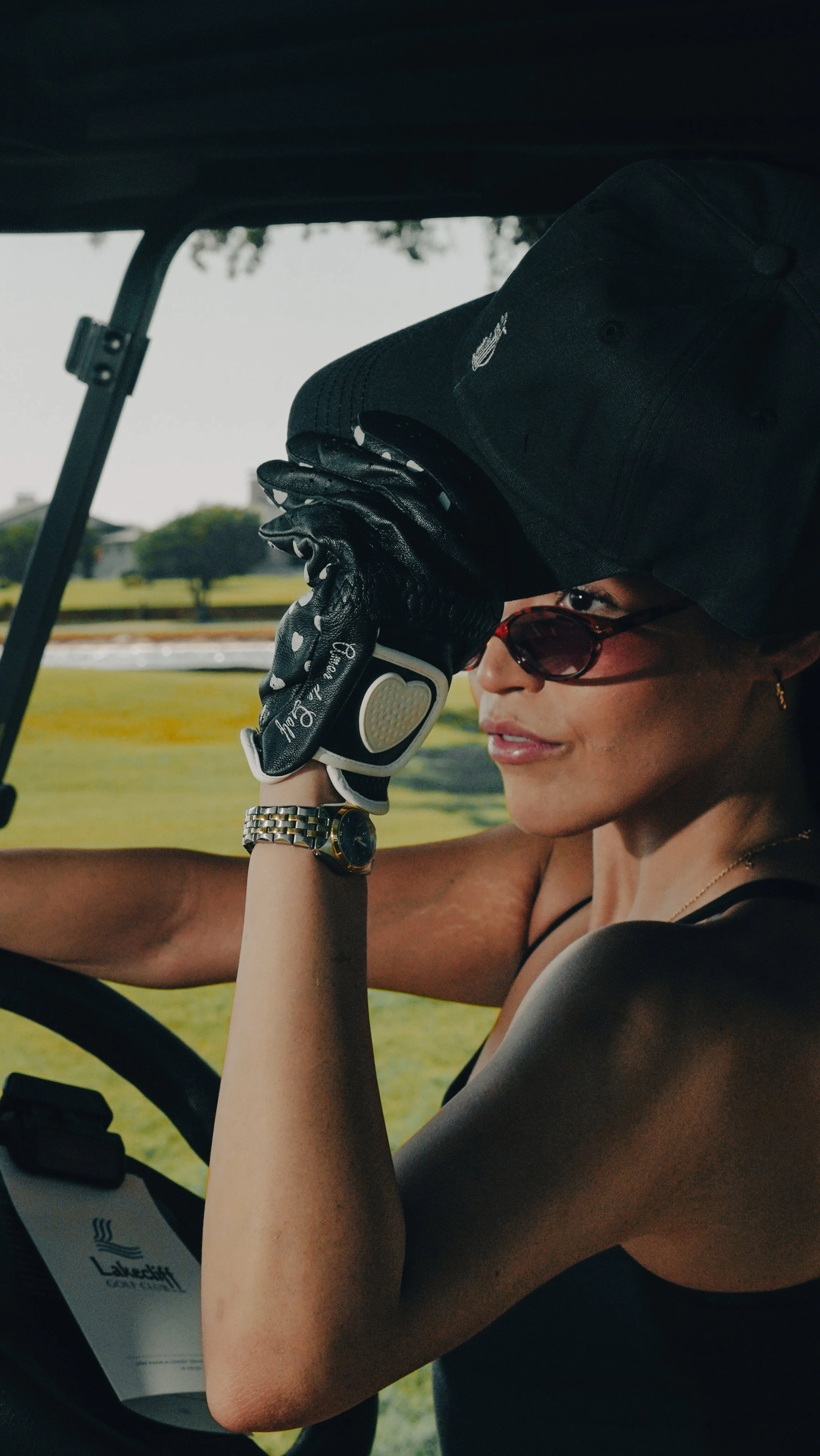 Woman wearing Southside golf apparel and hat in Austin, Texas