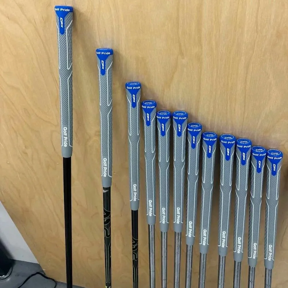 Golf clubs with newly installed grips at Southside Golf Co, offering professional golf club regripping services in South Austin.